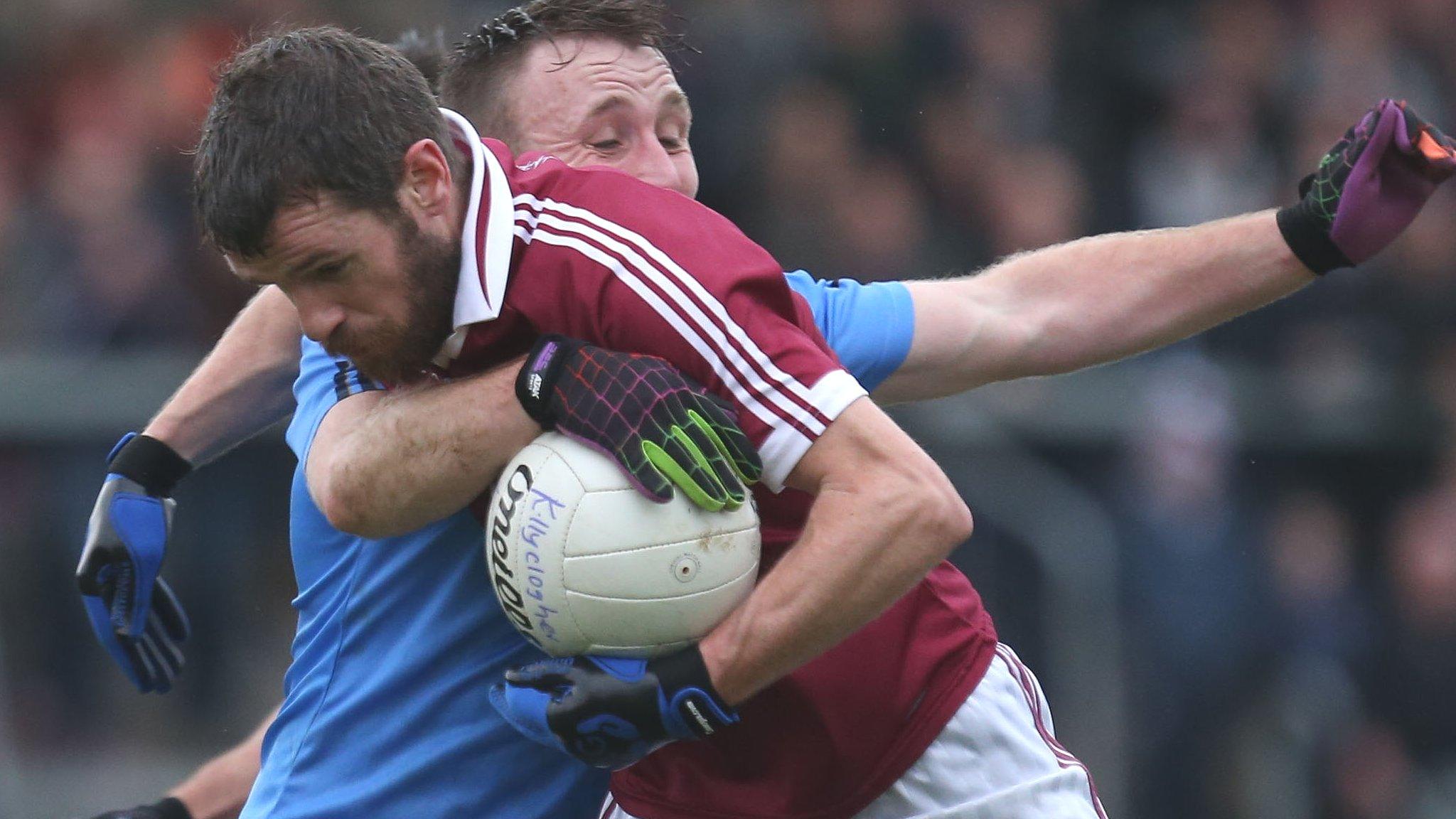 Killyclogher's Danny Gorman tackles Paul McNeill of Slaughtneil