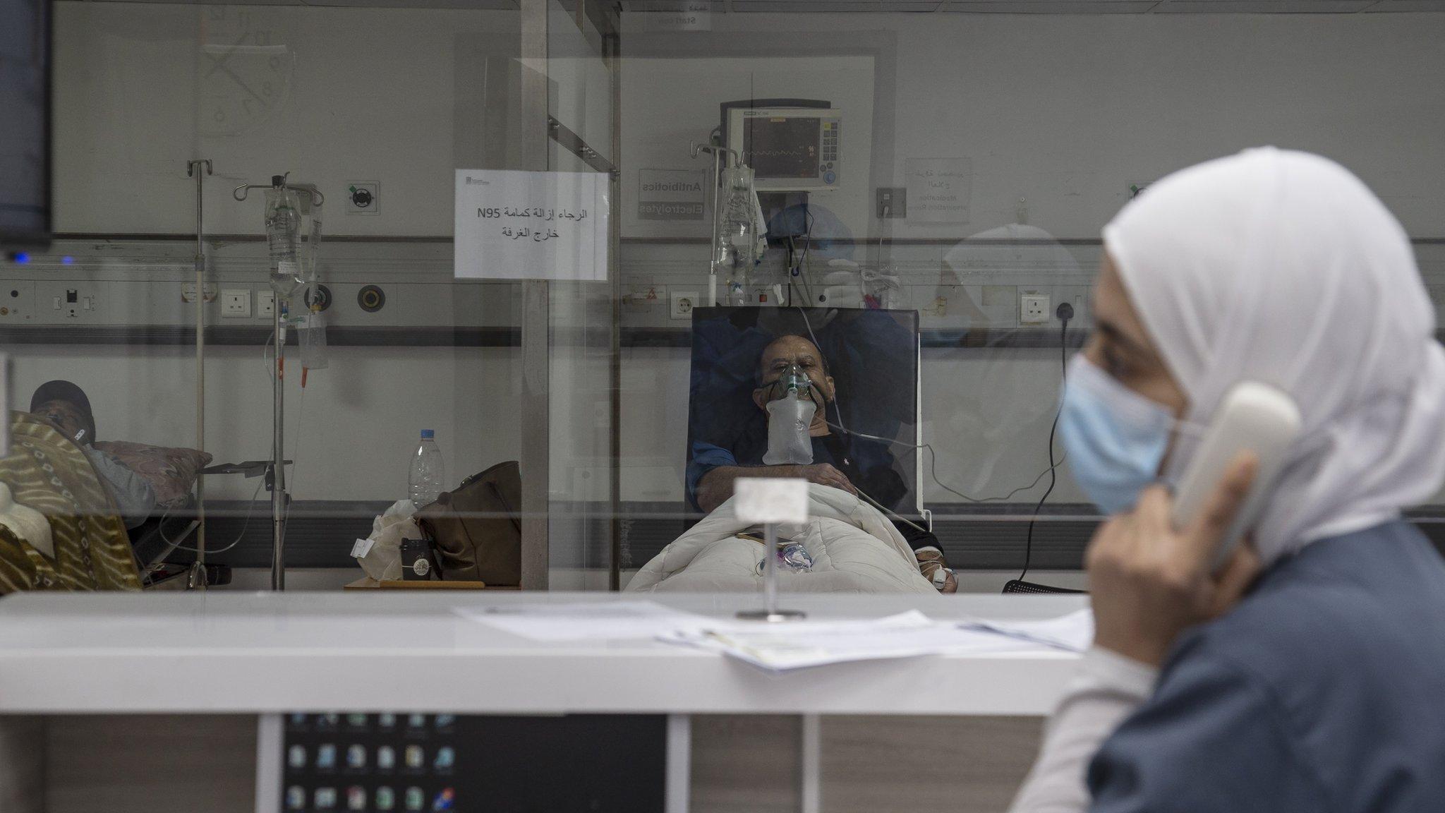 Healthcare staff and nurses watch over Covid-19 patients in an intensive care unit at Rafik Hariri University Hospital in Beirut, Lebanon (7 January 2021)