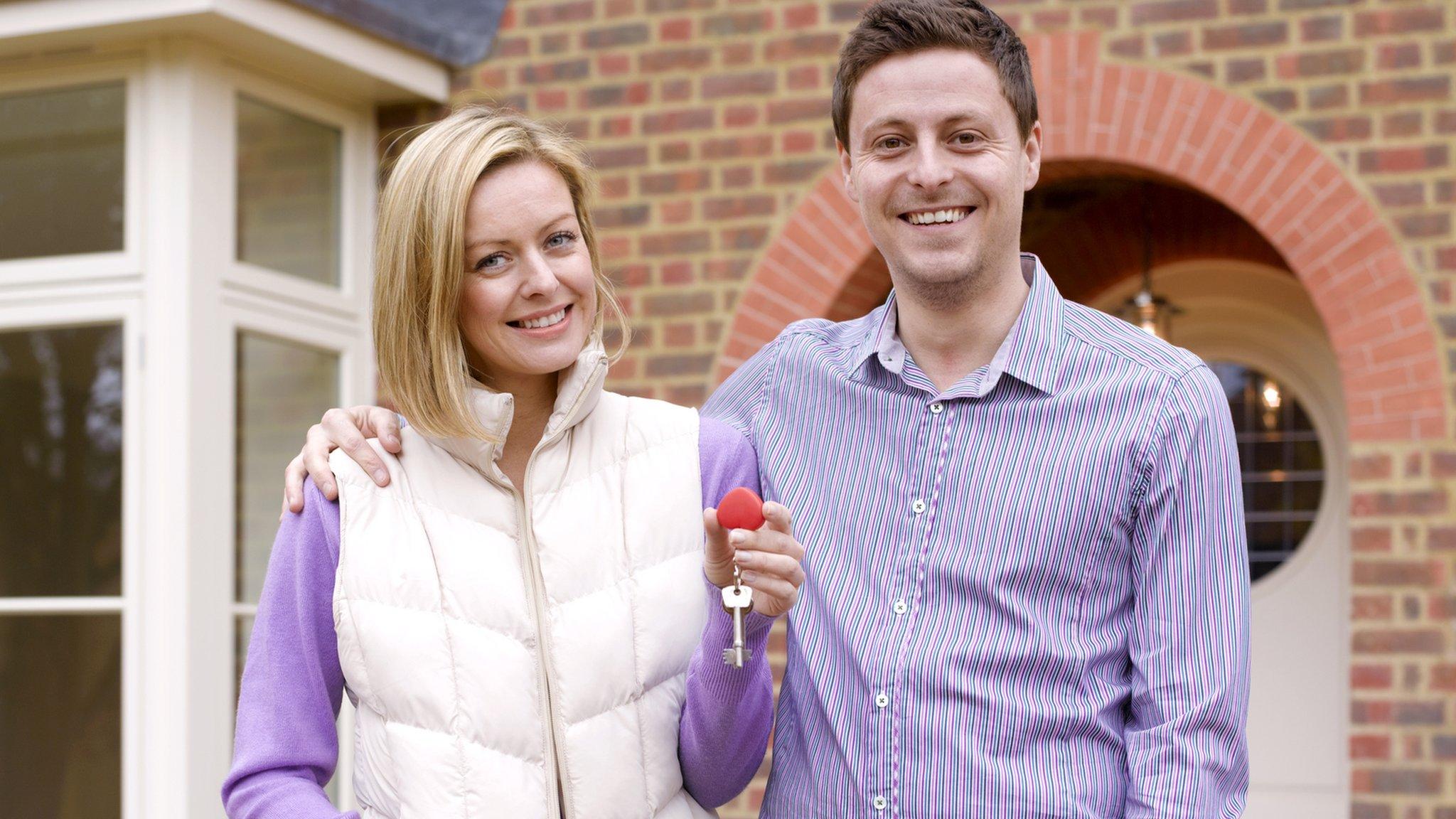 Young couple with new home