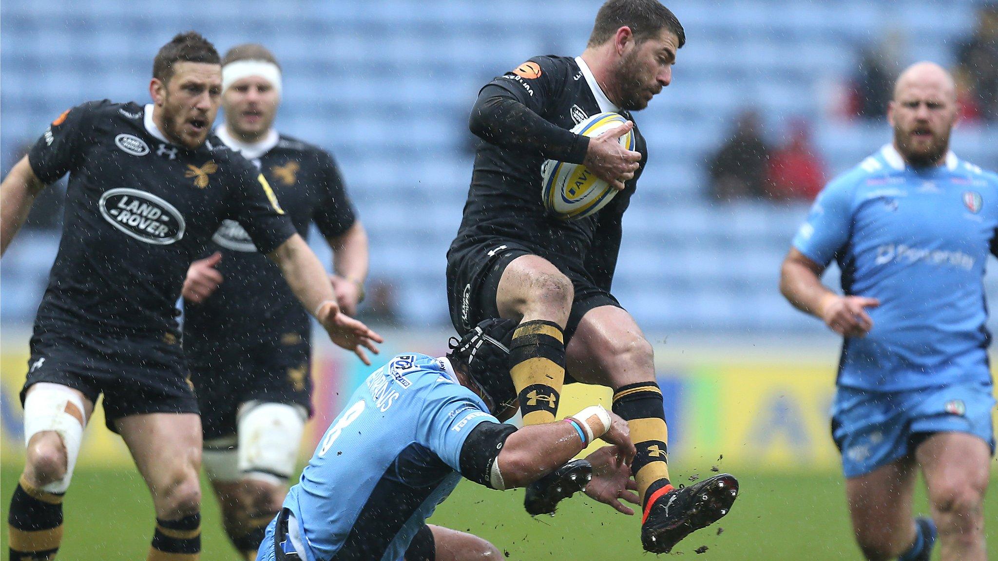 Wasps' Willie Le Roux attempts to evade an Ofisa Treviranus in their home win over bottom club London Irish at the Ricoh Arena