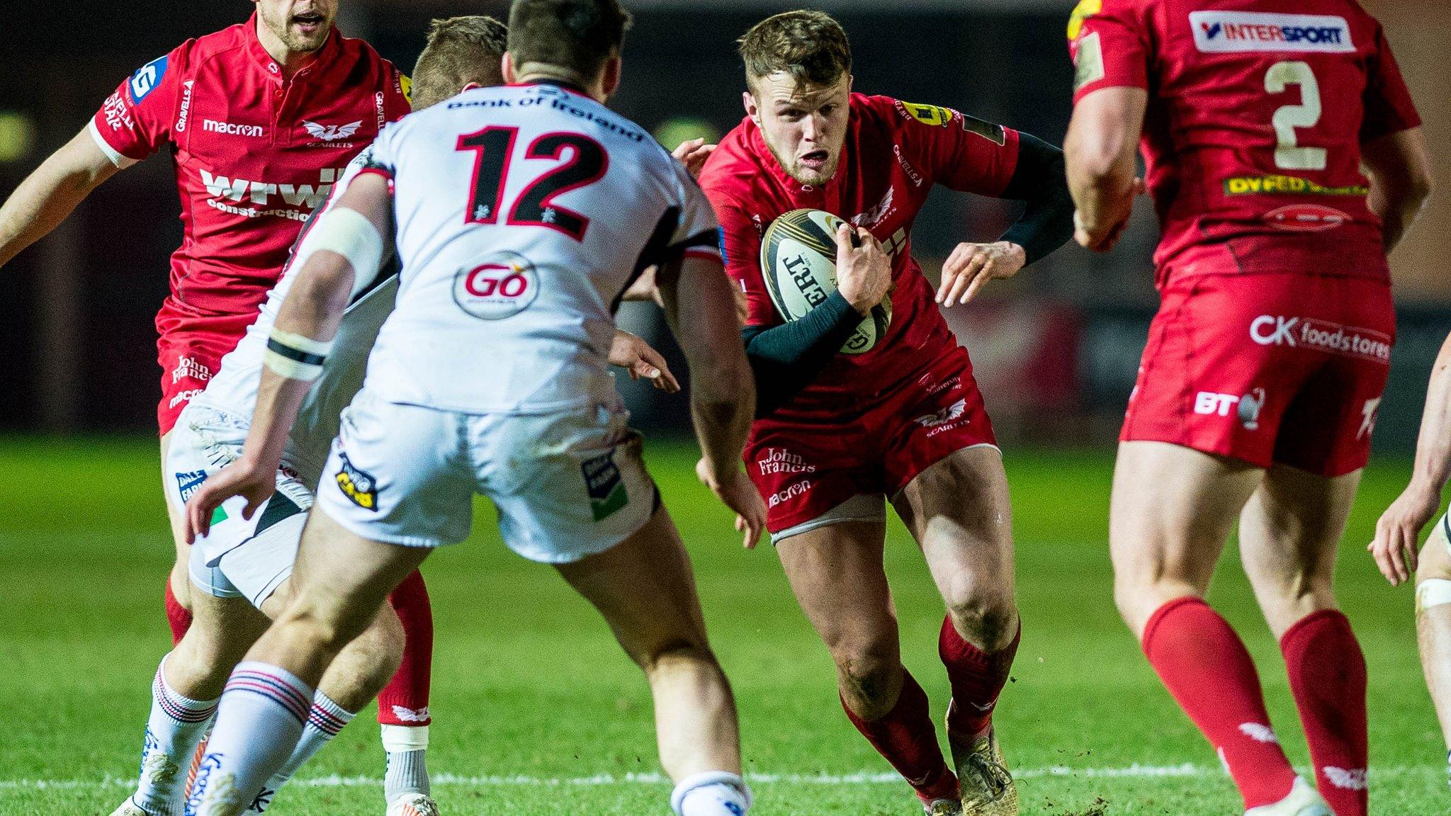 Steffan Hughes of Scarlets moves the ball forwards