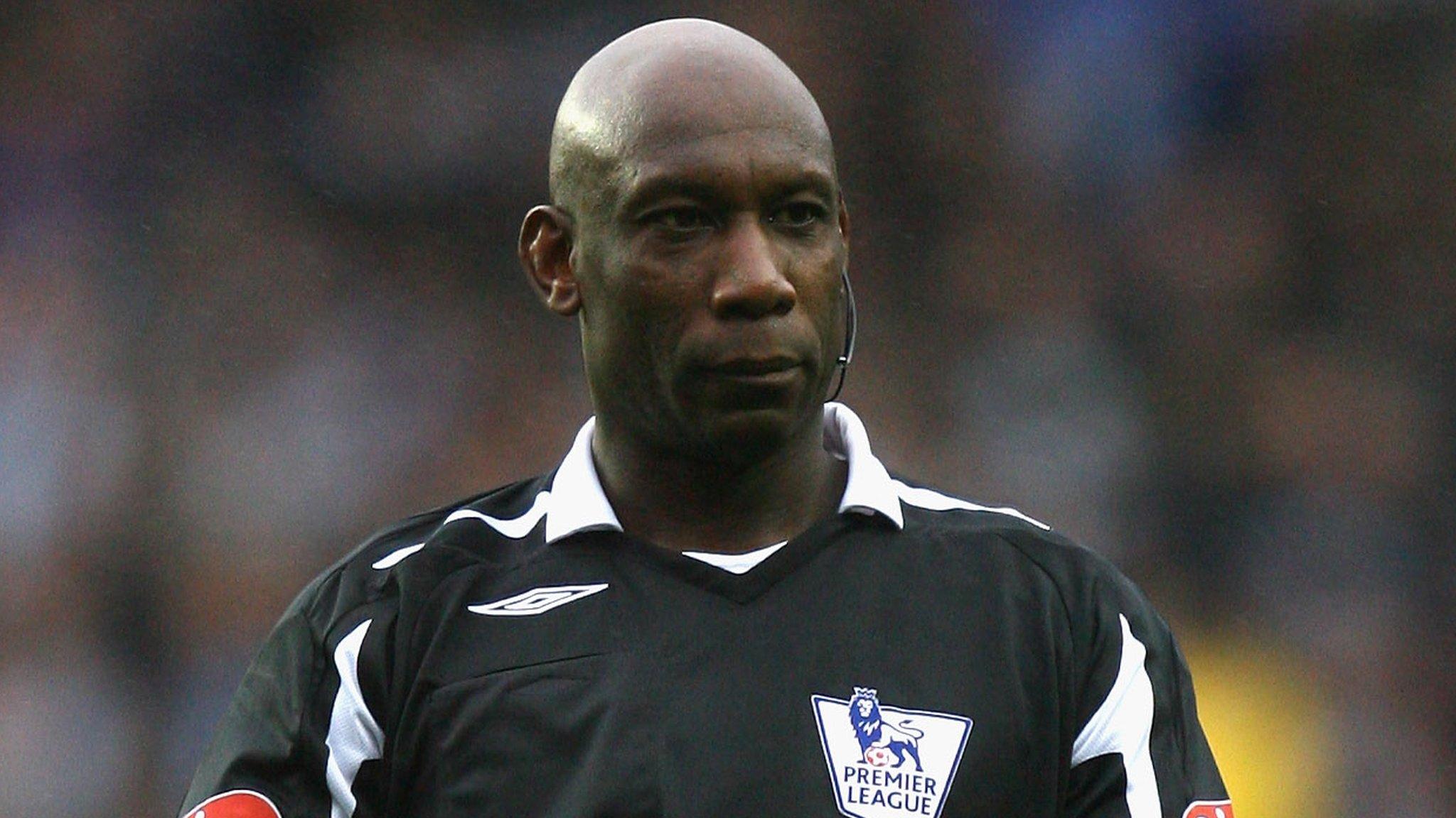 Uriah Rennie refereeing a match