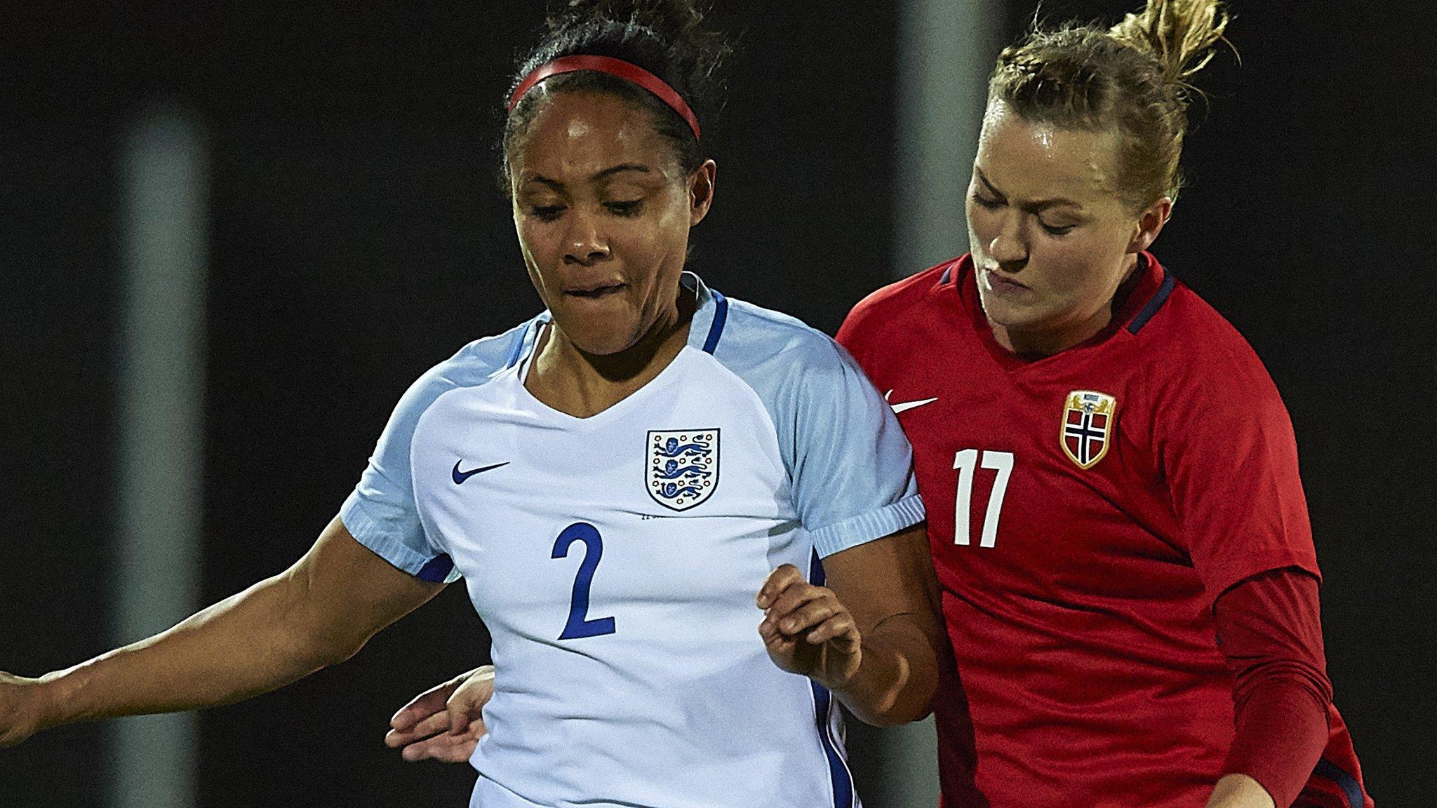 Kristine Minde of Norway competes for the ball with Alex Scott of England