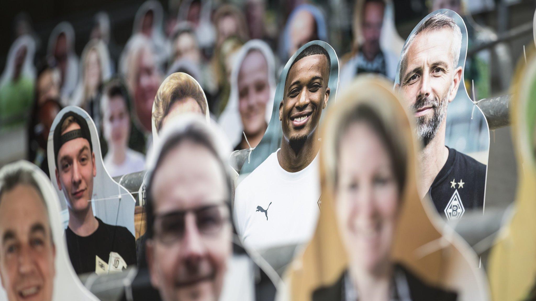 Pictures of fans, players, coaches and staff of Bundesliga club Borussia Moenchengladbach are seen at Borussia-Park