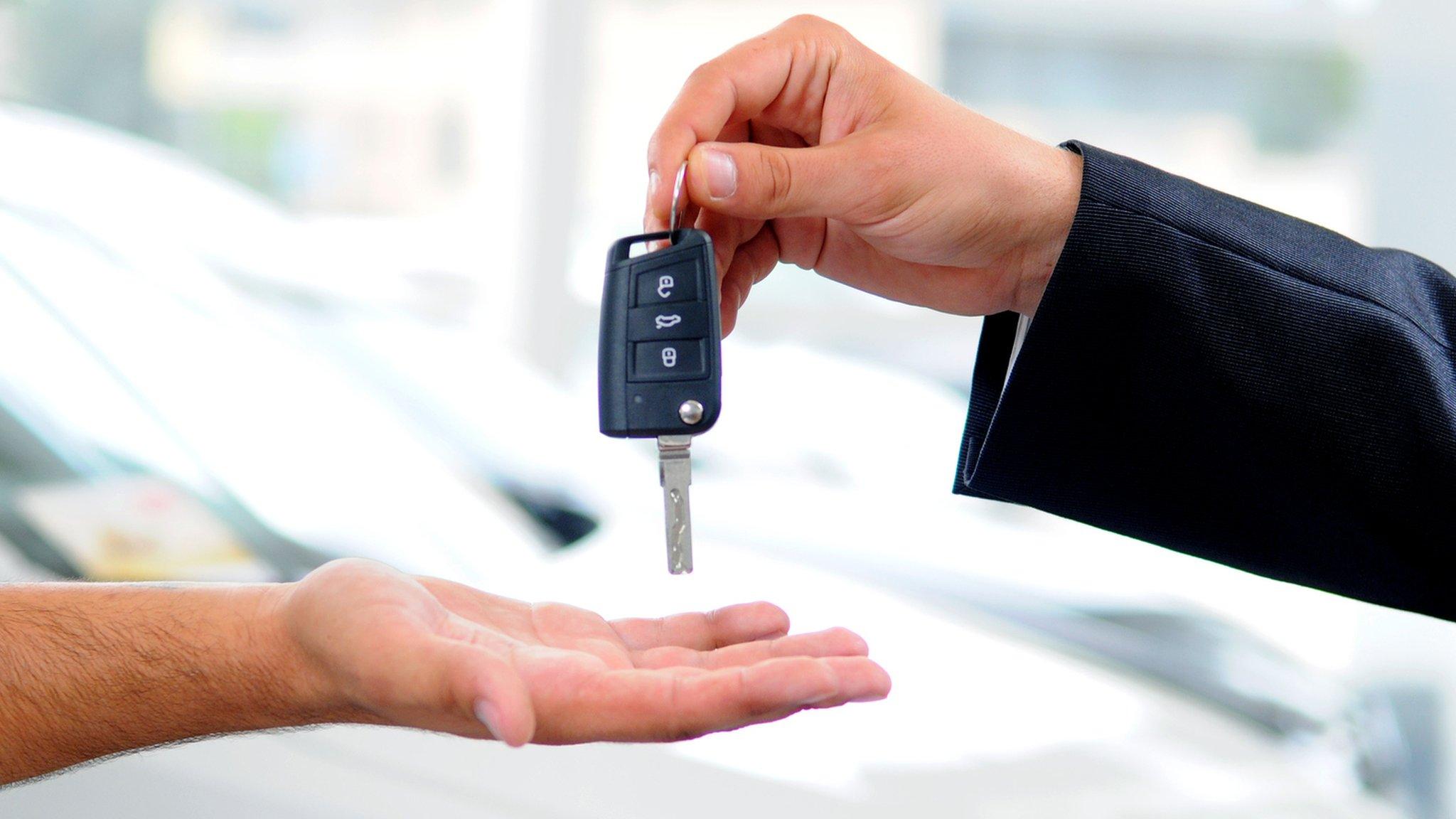 car key being handed over