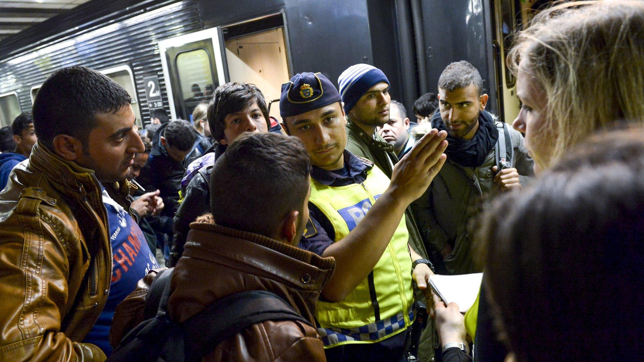 File photo of migrants catching a train from Malmo to Stockholm, September 2015