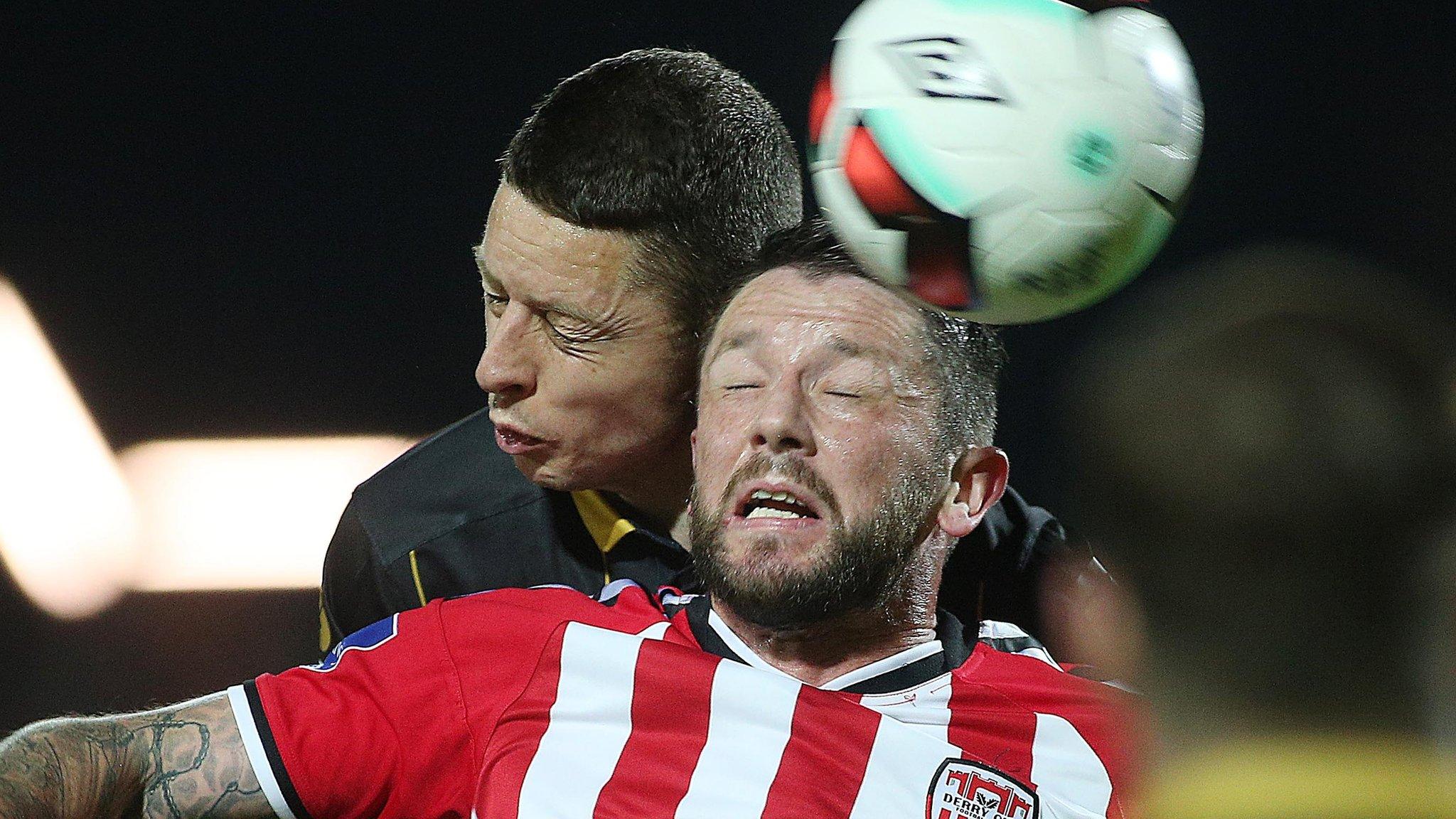 Derry's Rory Patterson battles with Dundalk's Shane Grimes at the Brandywell