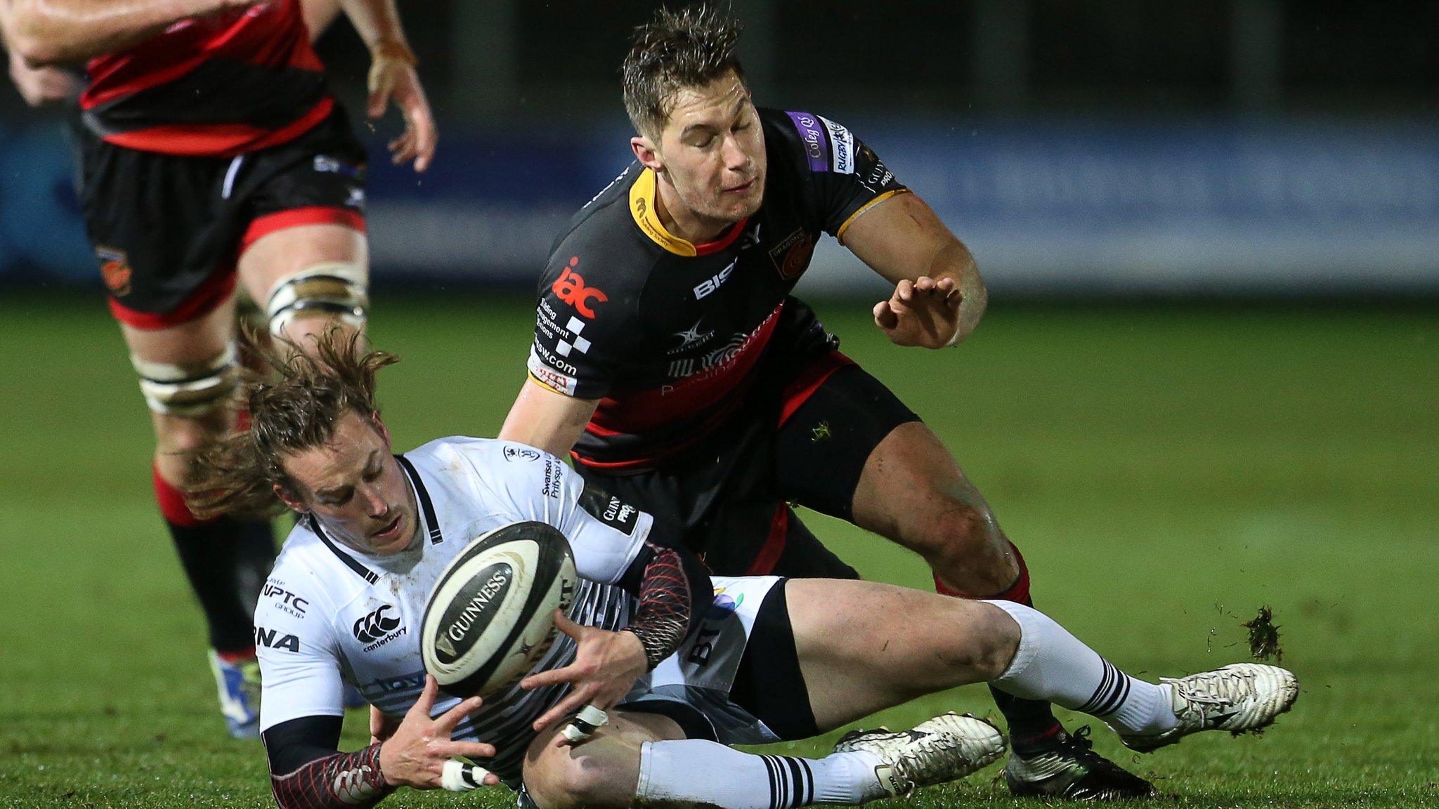 Dragons v Ospreys action shot, Jeff Hassler of Ospreys is tackled by Carl Meyer of Dragons