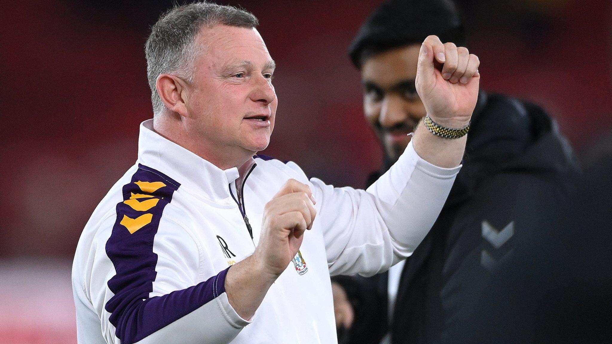 Mark Robins celebrates