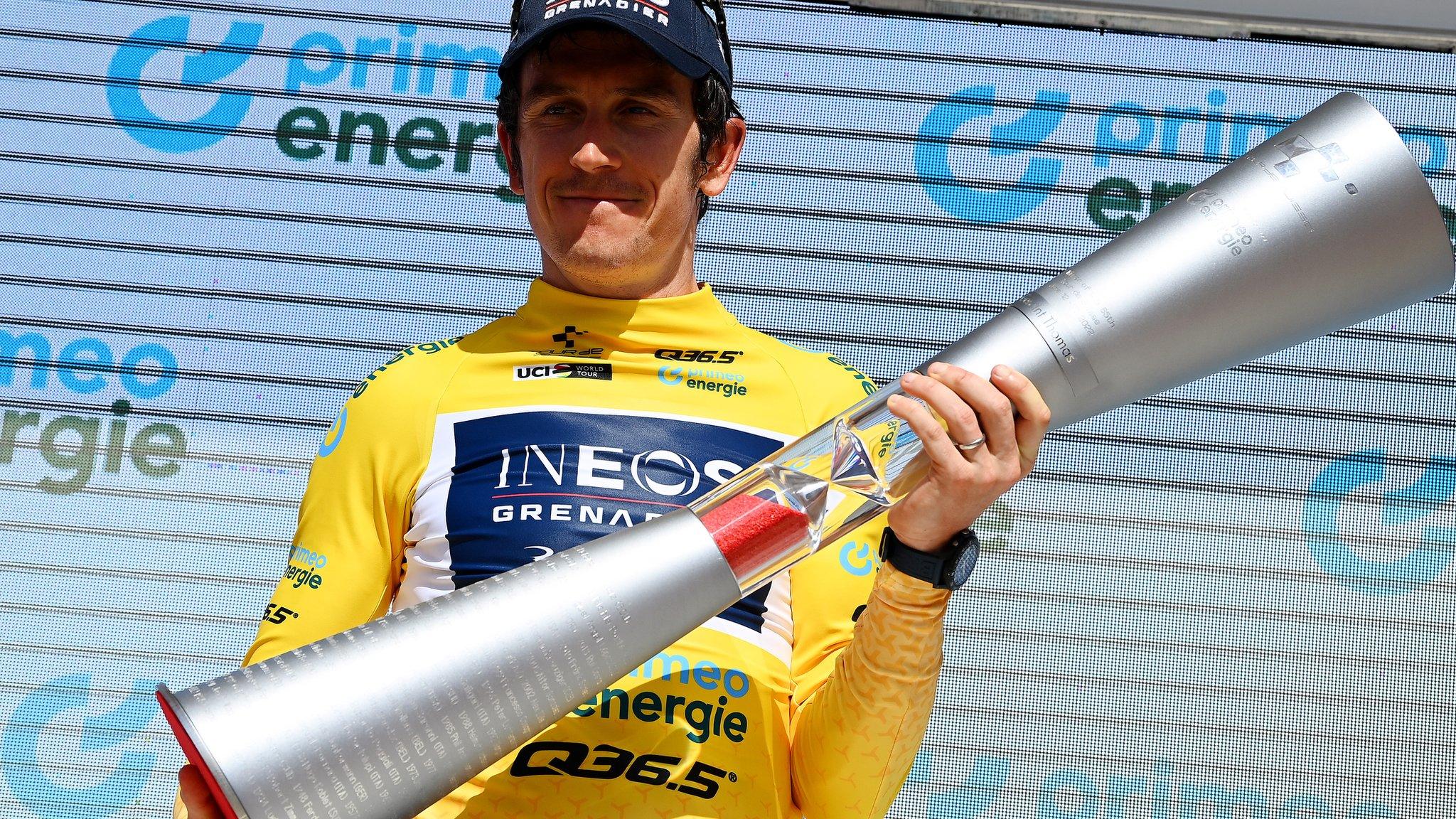 Geraint Thomas displays the winner's trophy