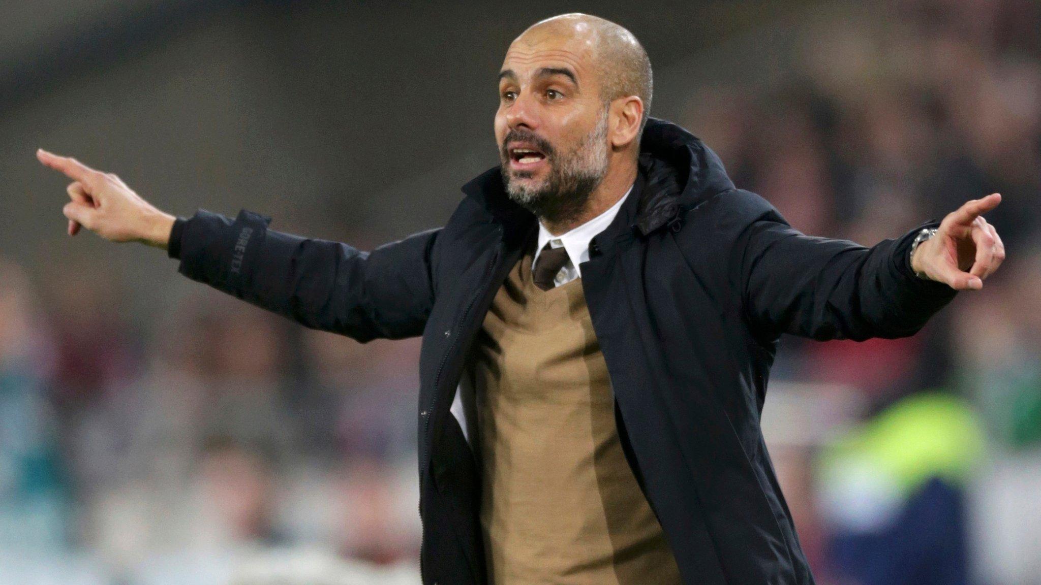 Pep Guardiola gestures during his team's match against Hanover 96 at the HDI Arena,