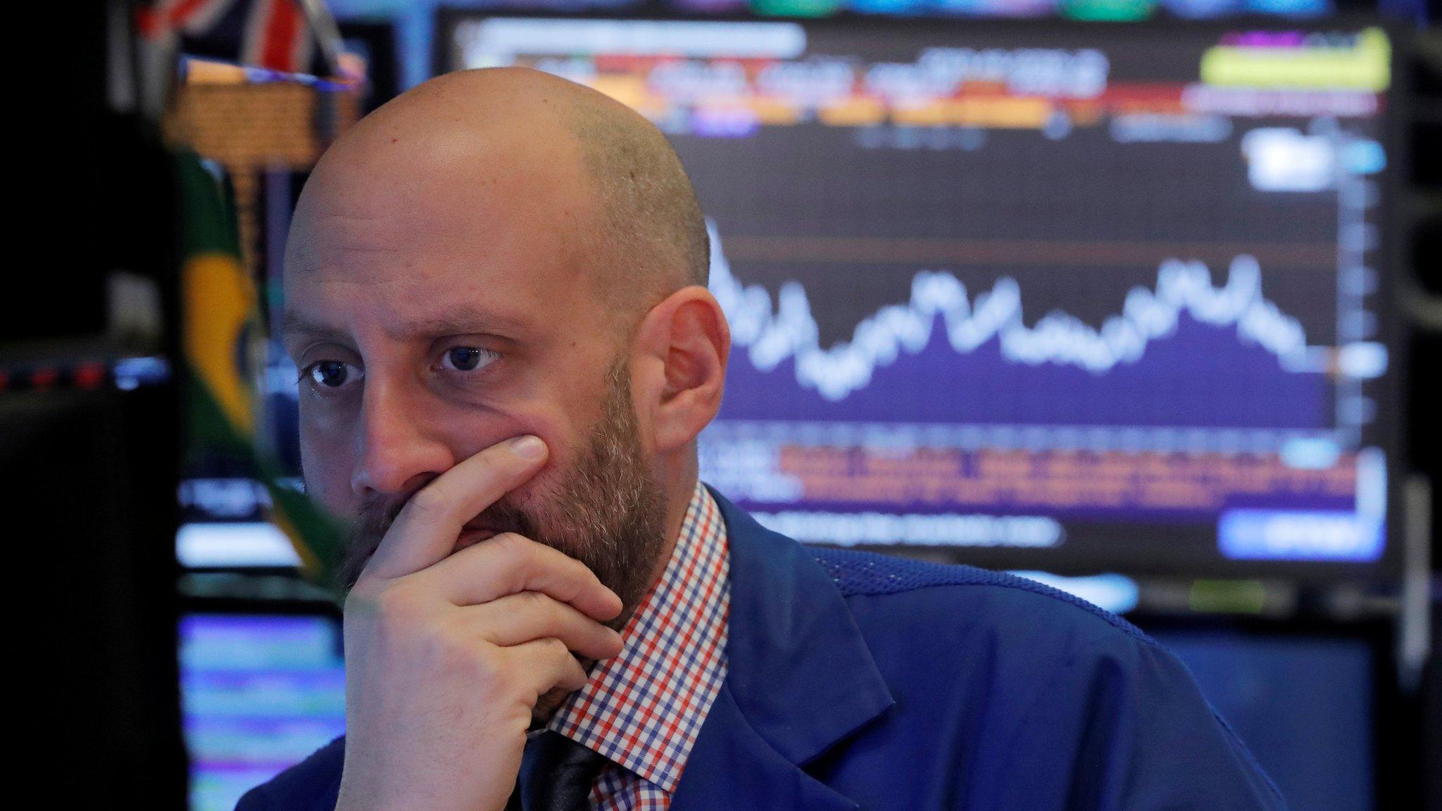 A trader works on the floor of the New York Stock Exchange (NYSE) in New York, U.S., October 23, 2018.