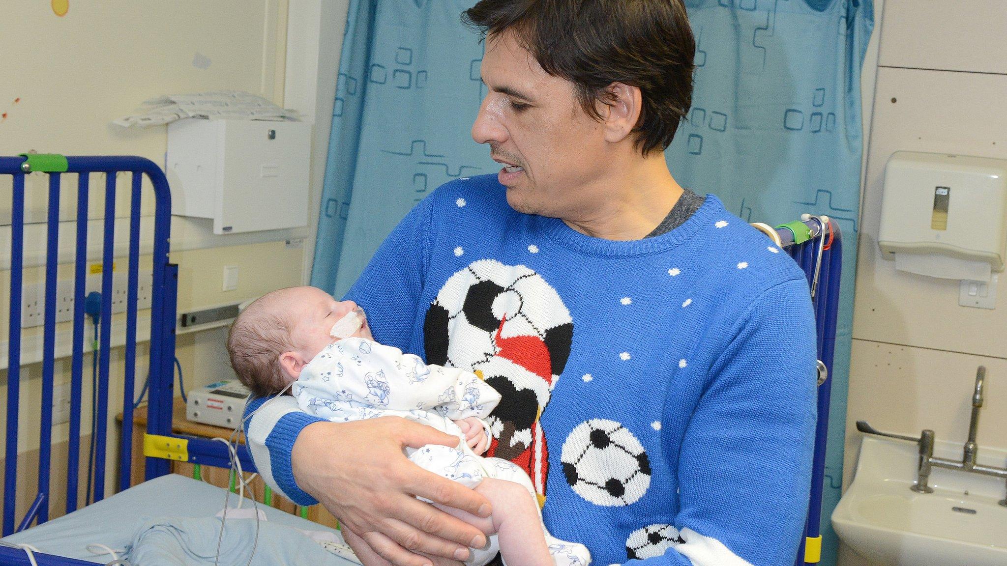 Sunderland manager Chris Coleman holds baby Logan Steel