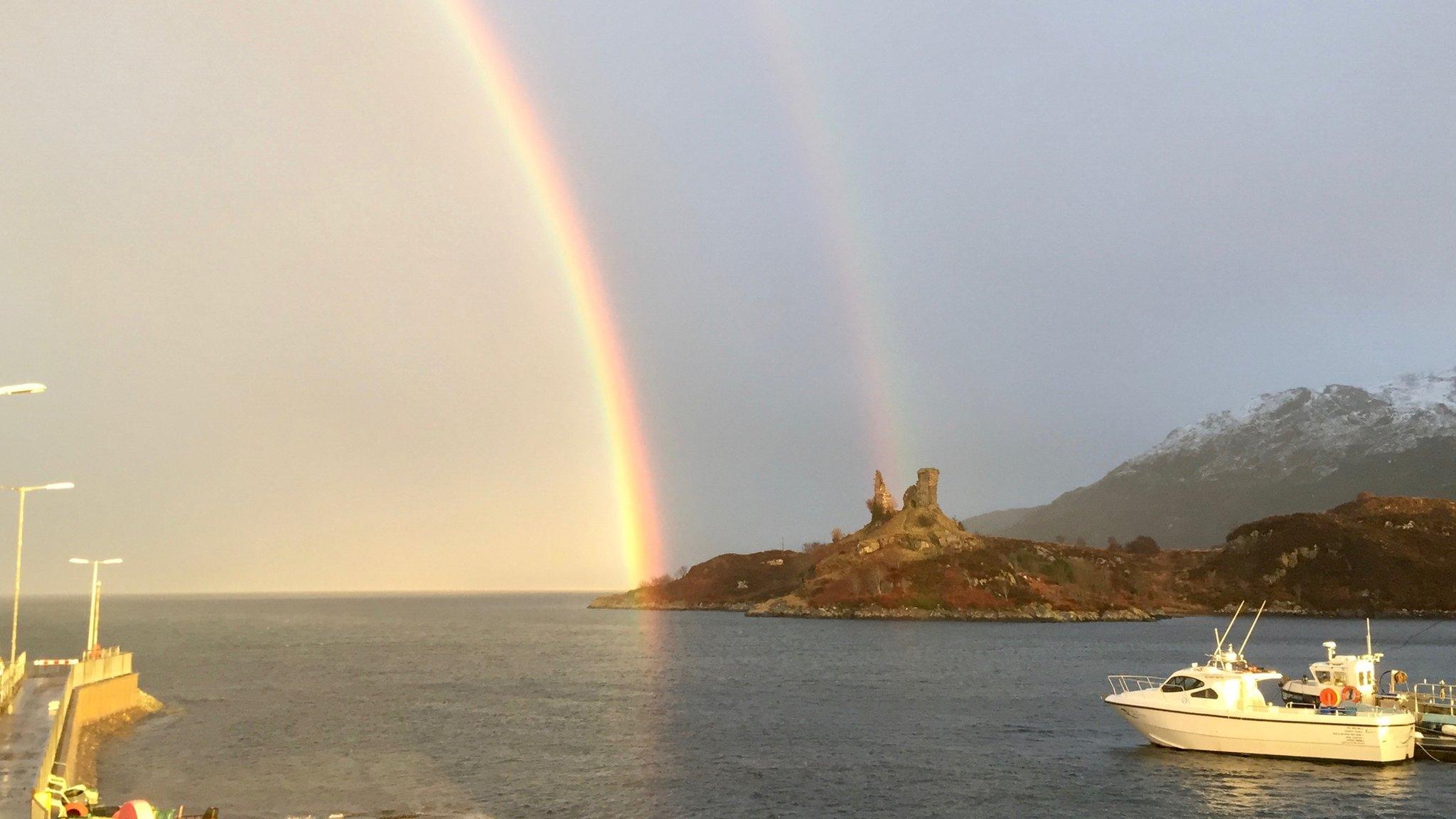 Castle Moil and rainbow before the lightning strike