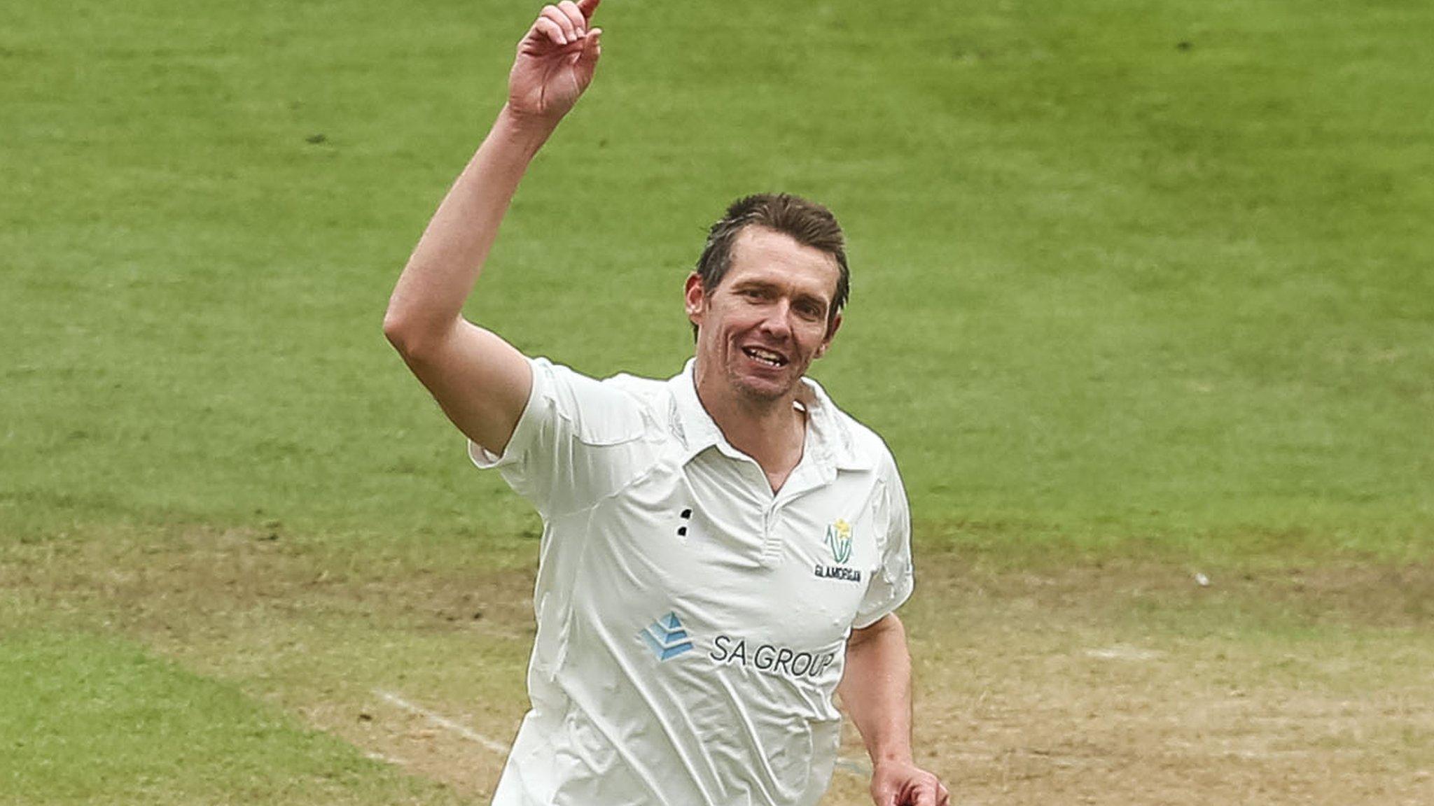 Michael Hogan of Glamorgan celebrates after taking the wicket of Joseph Ludlow of Cardiff MCCU