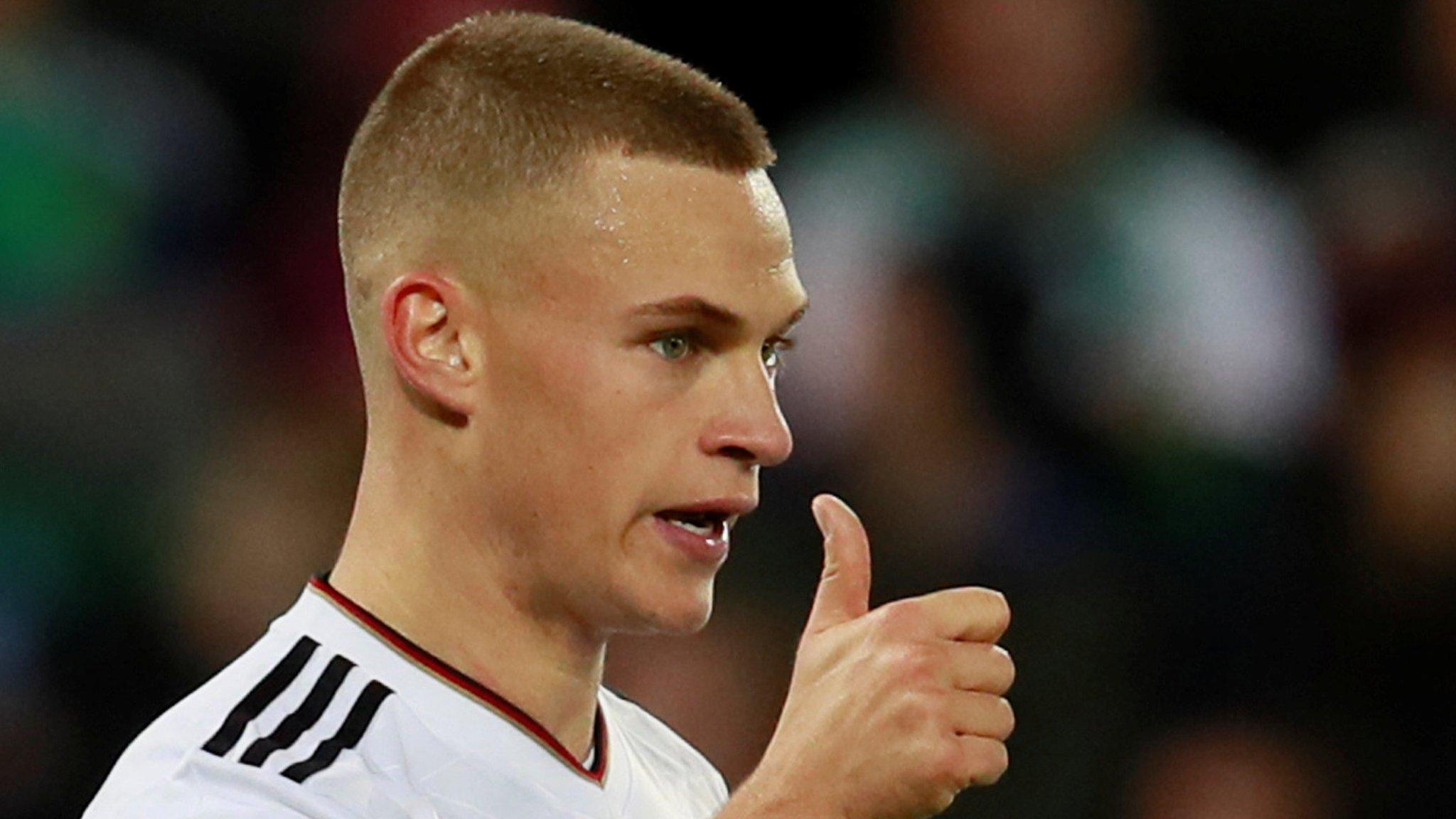 Joshua Kimmich celebrates after scoring Germany's third goal