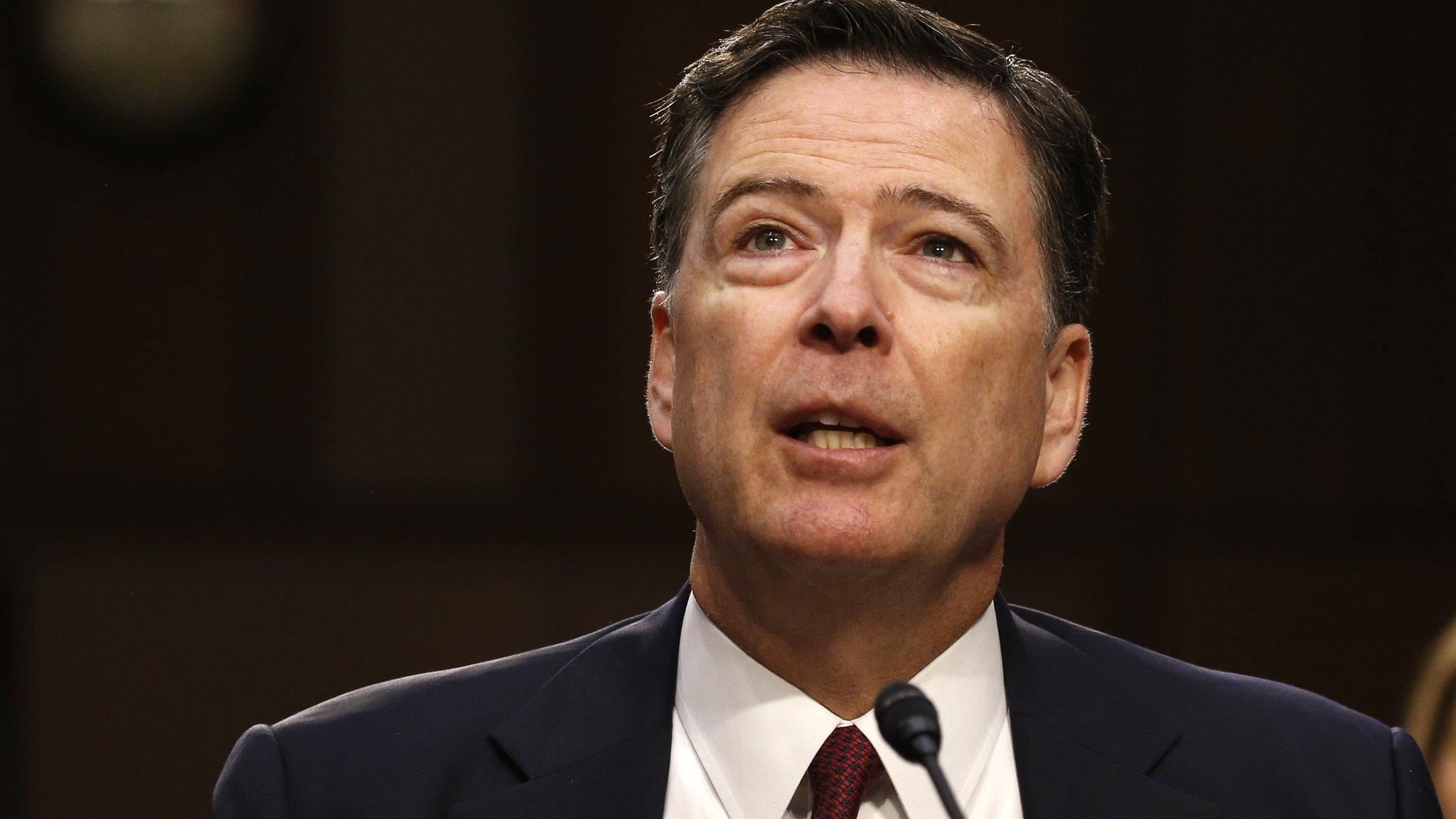 Former FBI Director James Comey testifies before a Senate Intelligence Committee