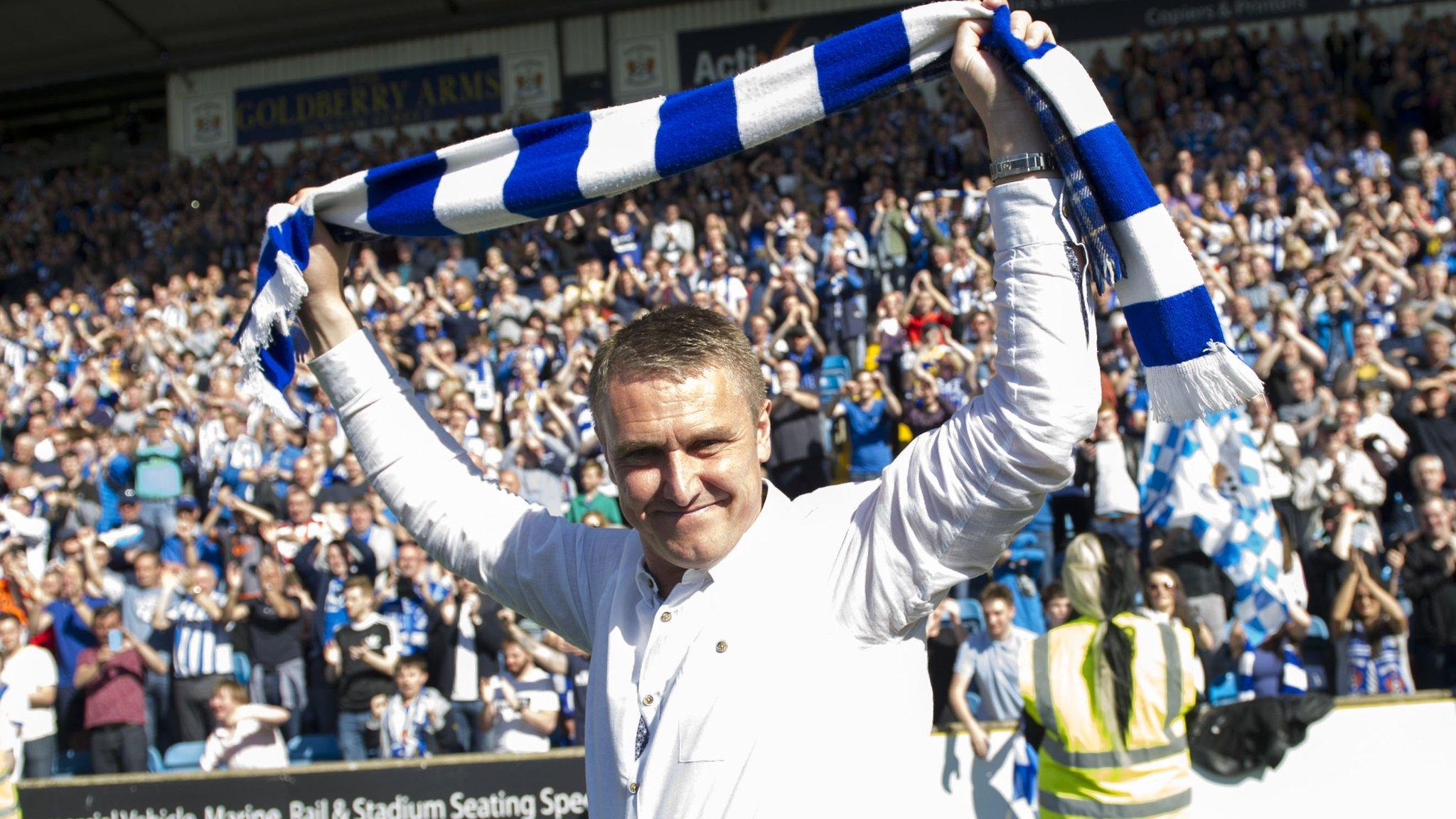 Lee Clark celebrates with a Kilmarnock scarf after their play-off victory