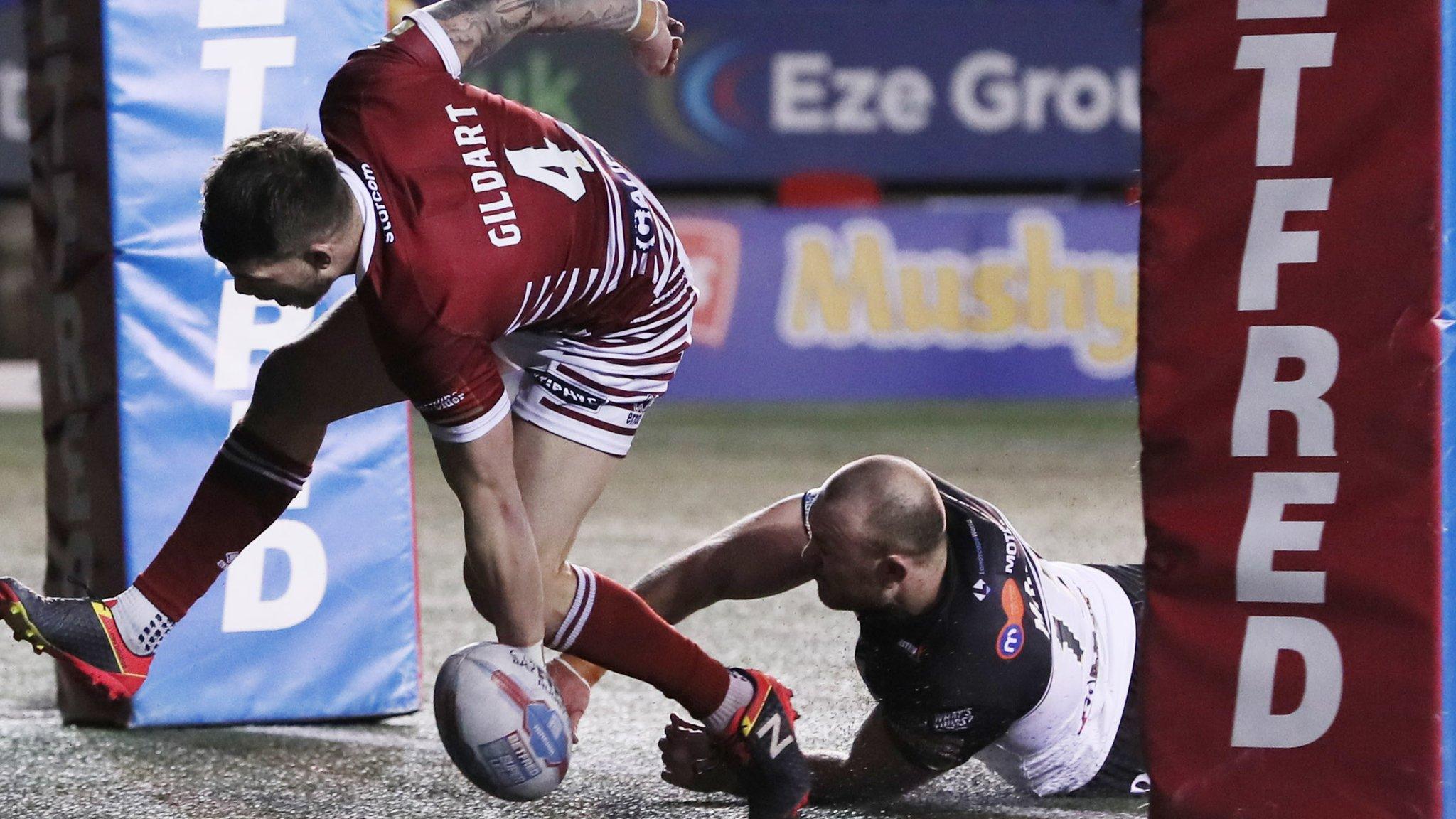 Oliver Gildart scores a try for Wigan against Widnes