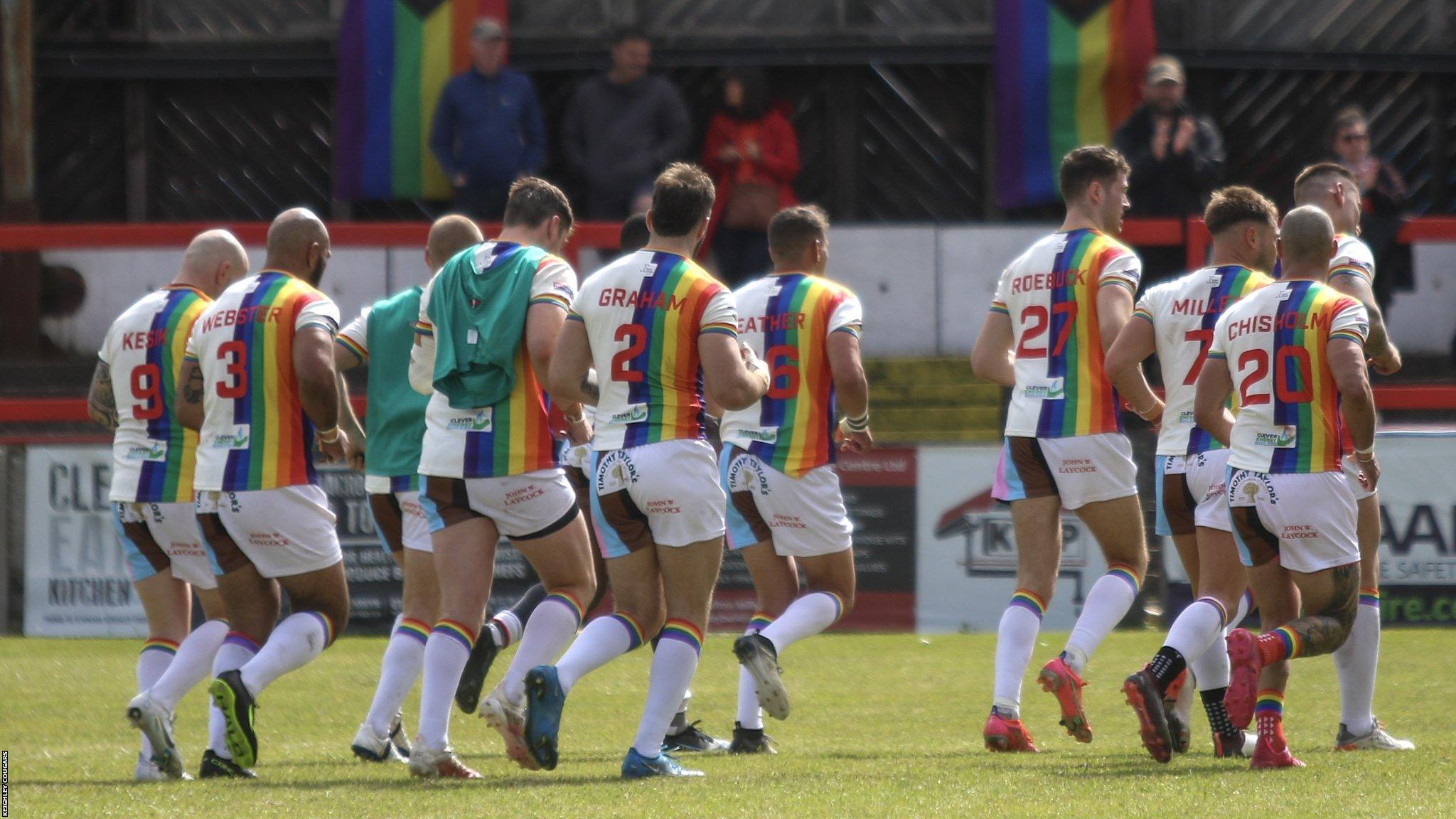 The team wearing Pride shirts