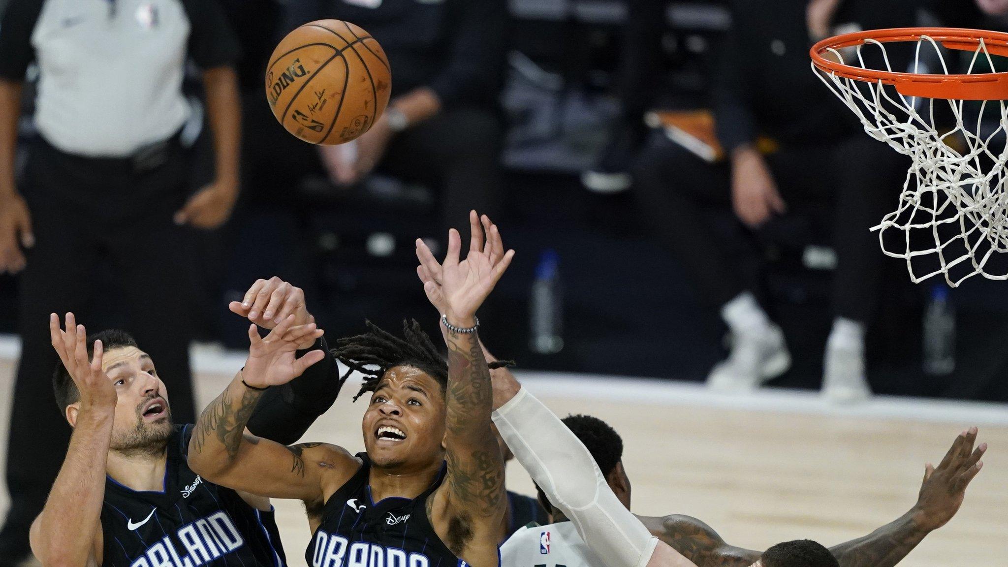 Players playing basketball in a earlier match