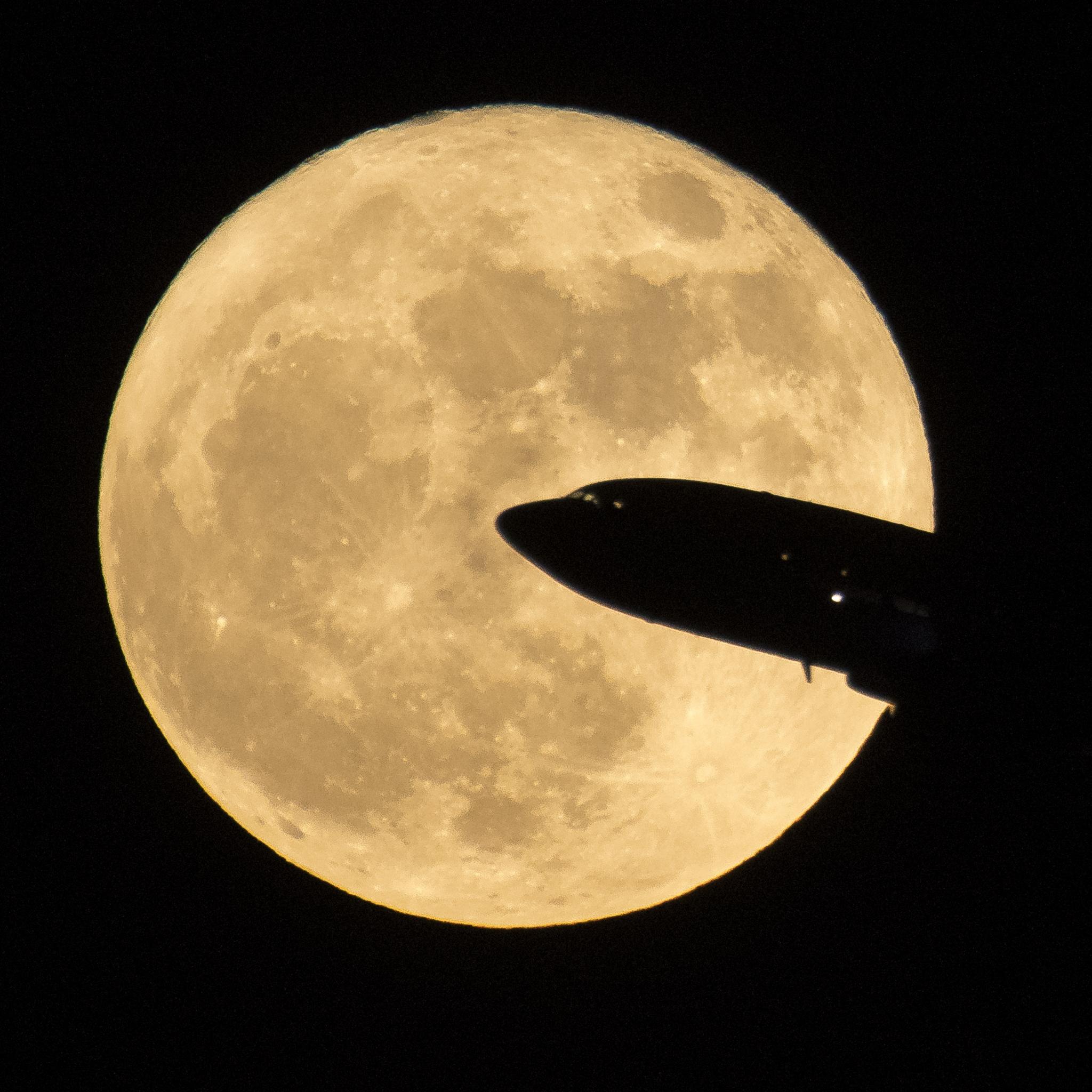 Supermoon with aeroplane