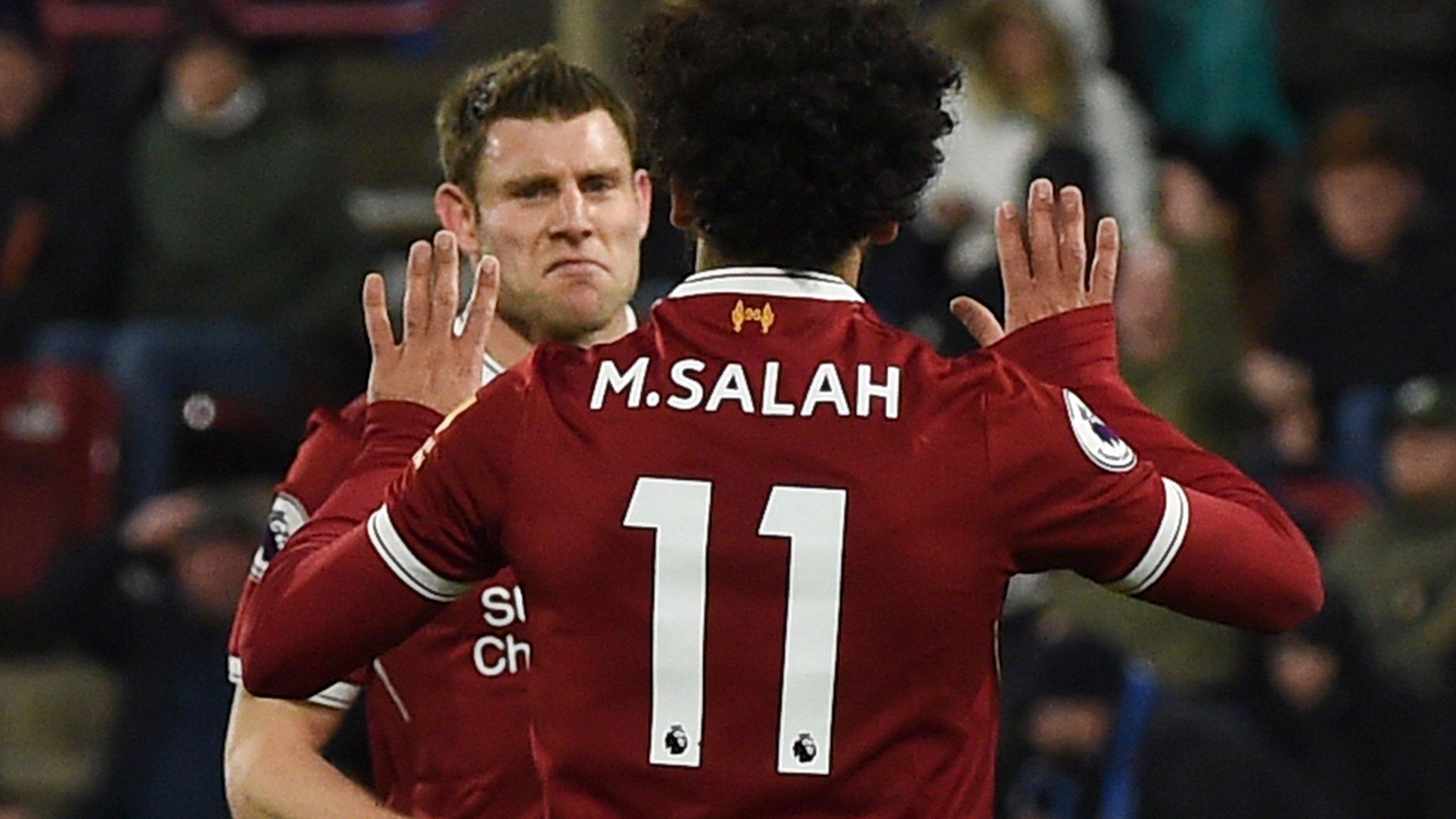 James Milner celebrates with Mohamed Salah