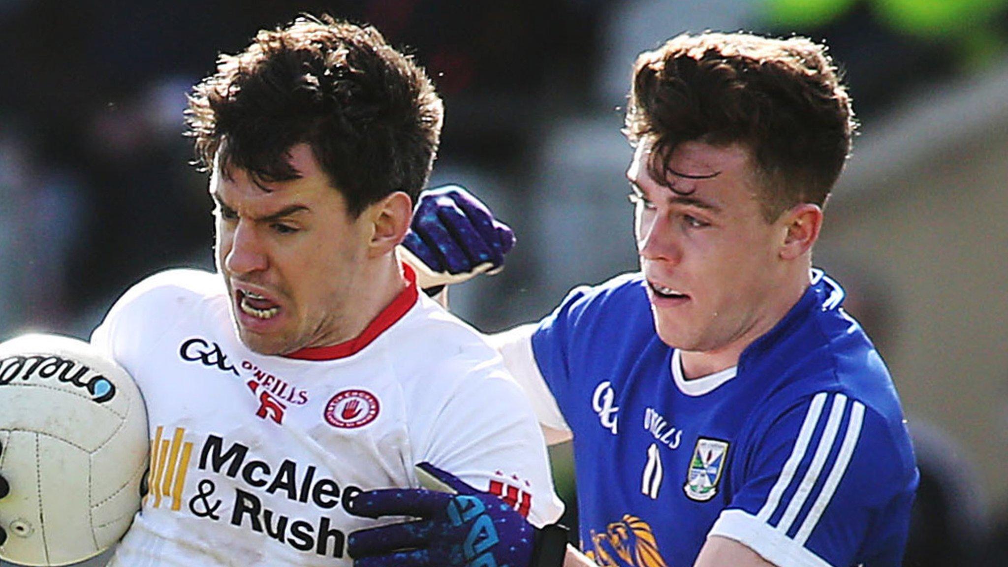 Tyrone's Mattie Donnelly battles with Cavan's Dara McVeety