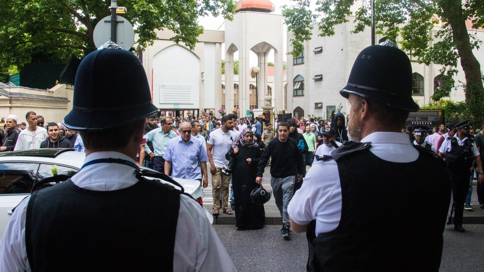 Police guard Muslim worshippers as they gather for Friday prayers, following the Finsbury Park attack