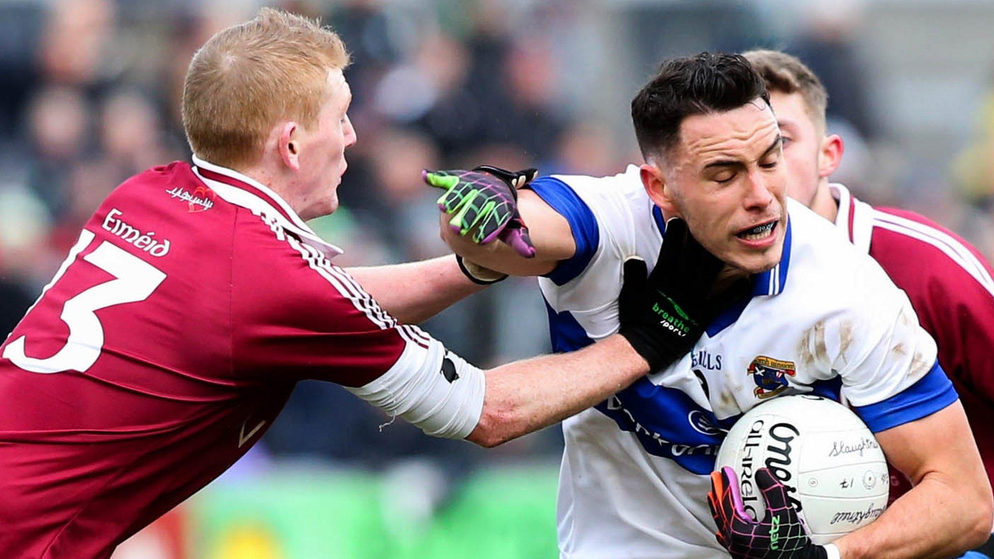 St. Vincent's Shane Carthy with Christopher Bradley, Keelan Feeney and Patsy Bradley of Slaughtneil