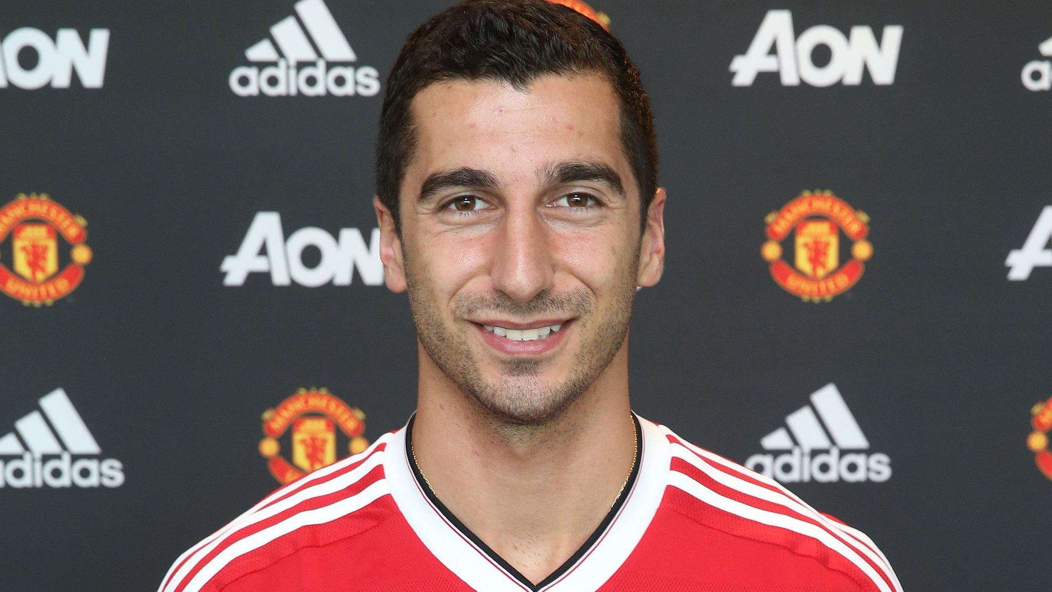 Henrikh Mkhitaryan poses in his Manchester United kit