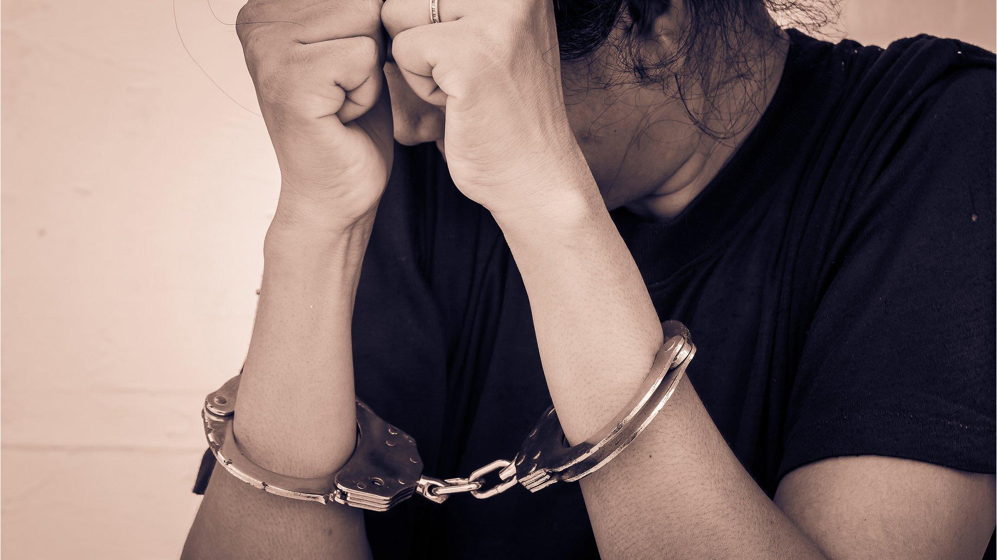 Woman in handcuffs