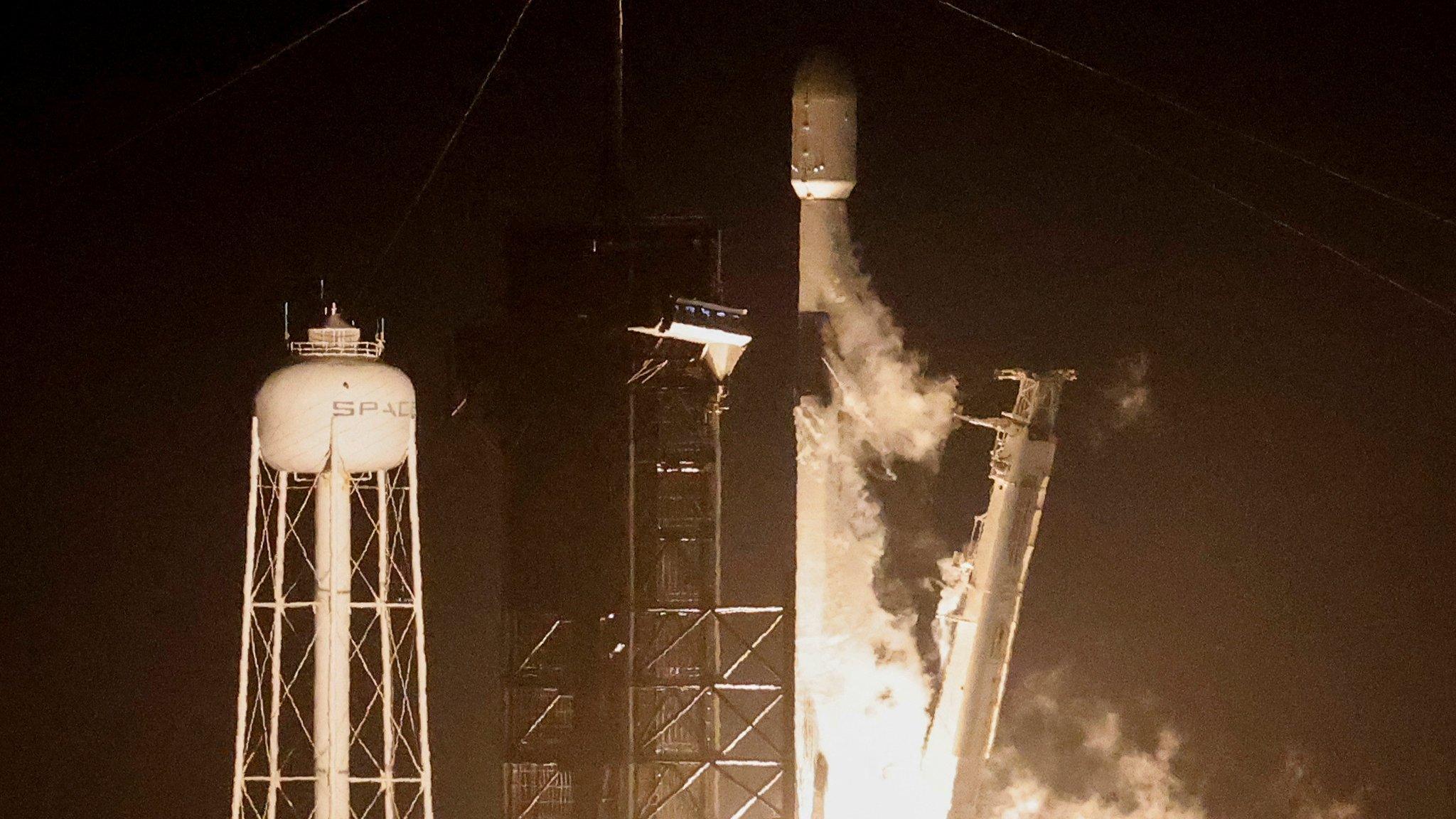 Space X flacon 9 rocket launches into the sky