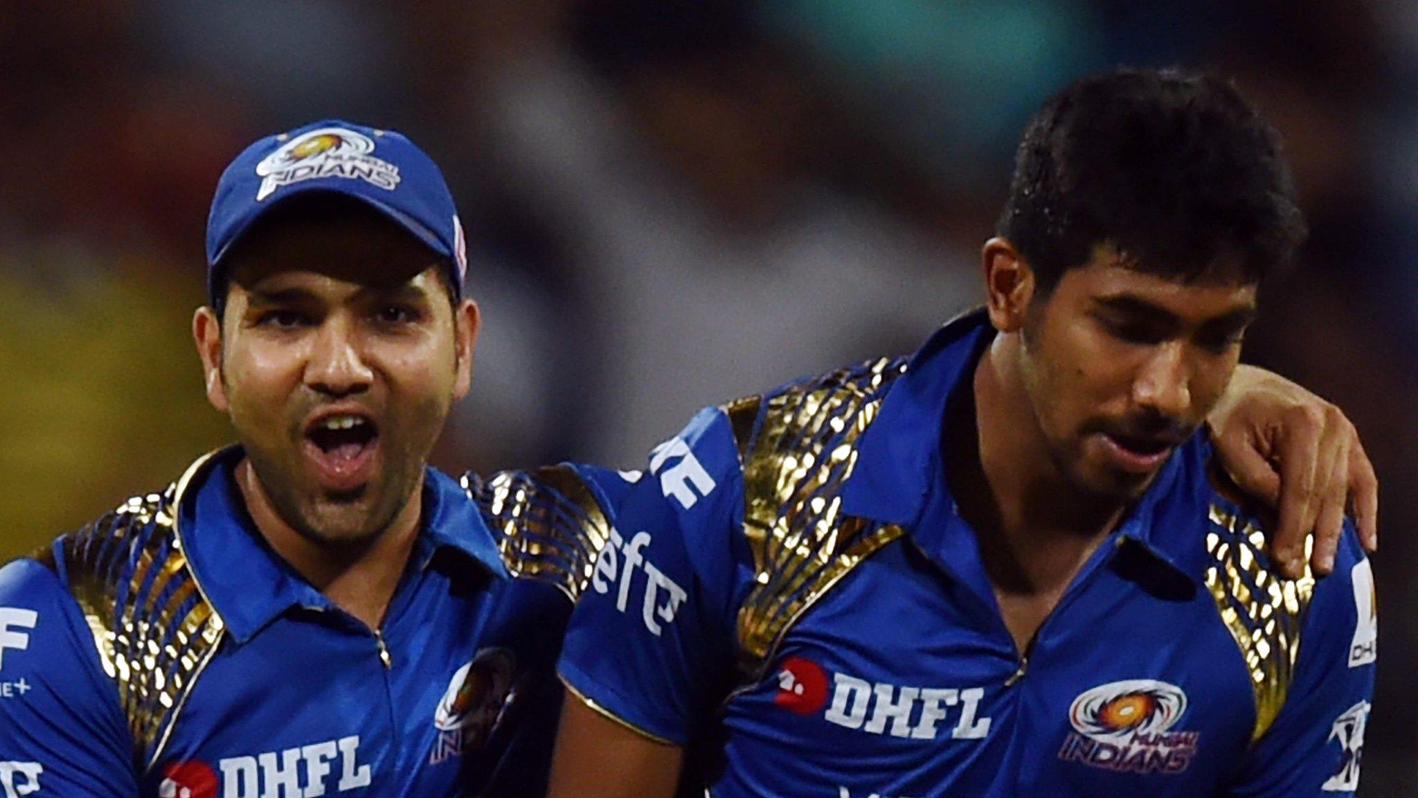 Mumbai Indians captain Rohit Sharma (left) and Jasprit Bumrah