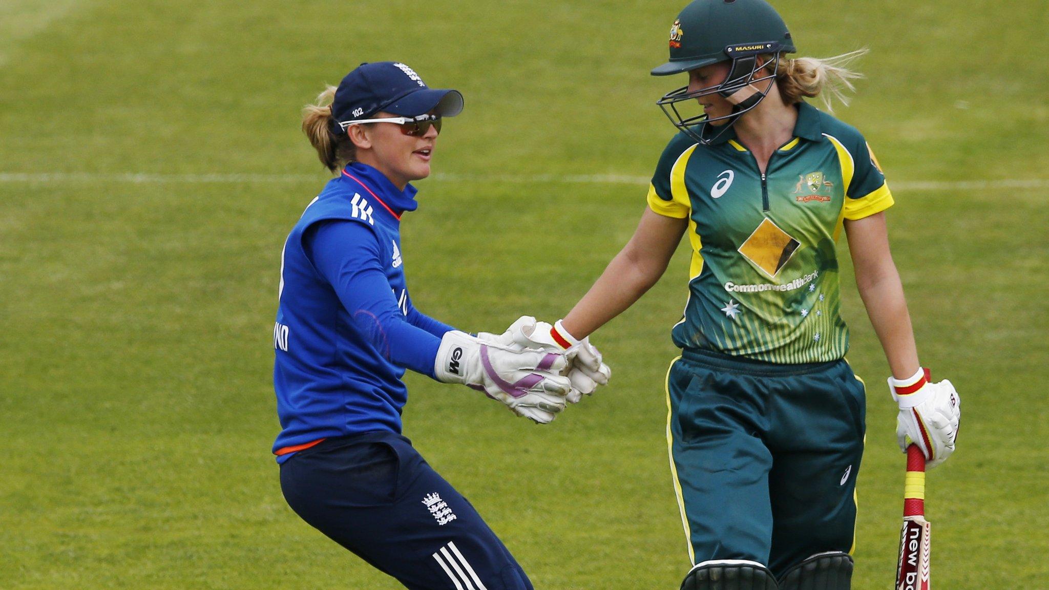 Sarah Taylor shakes Lanning's hand