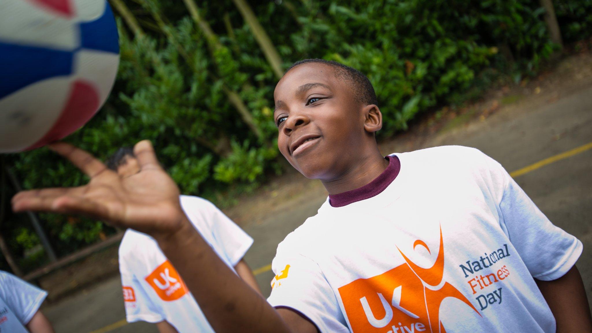 Boy playing basketball on National Fitness Day