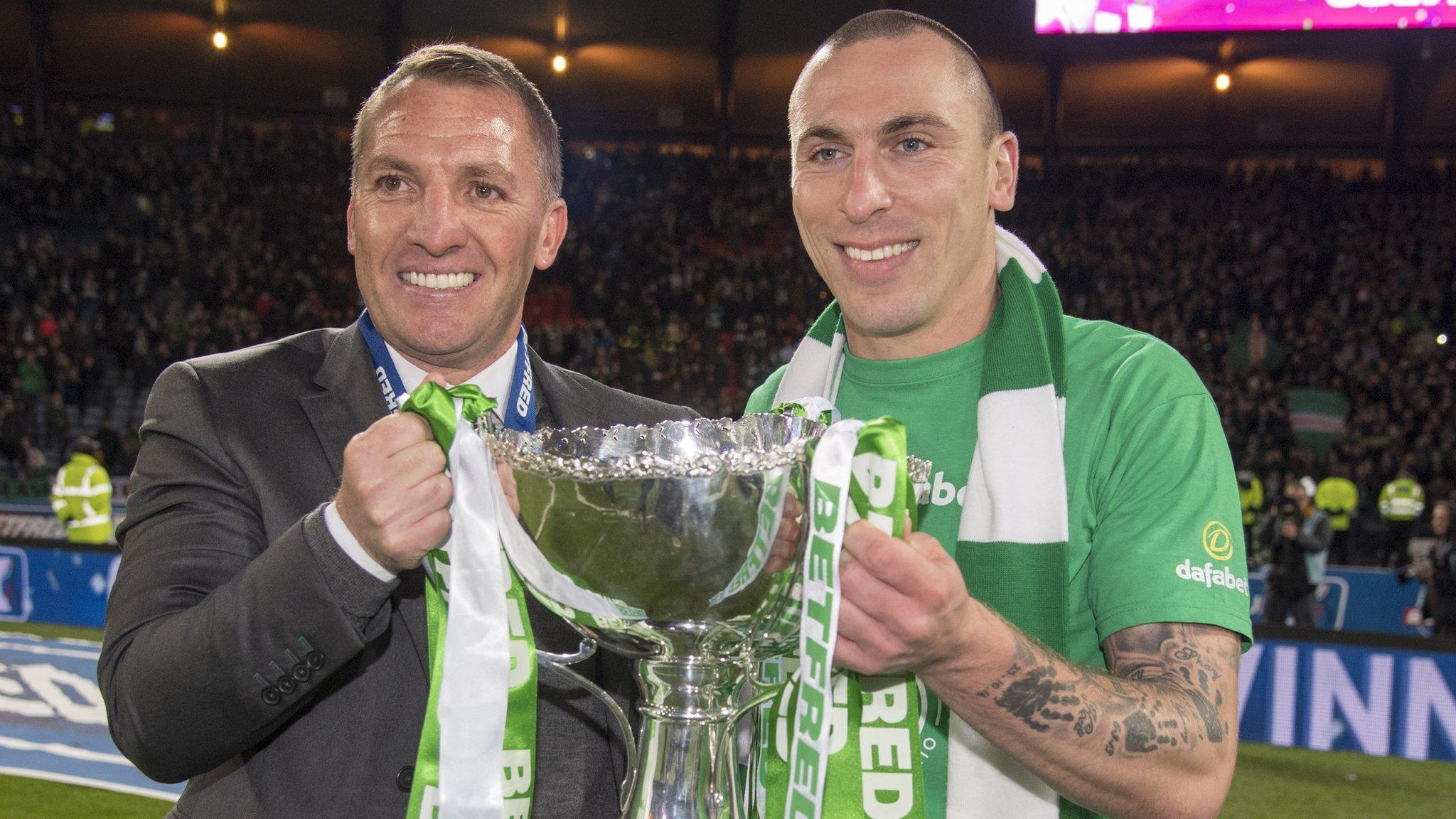 Brendan Rodgers holds the Scottish League Cup with Scott Brown