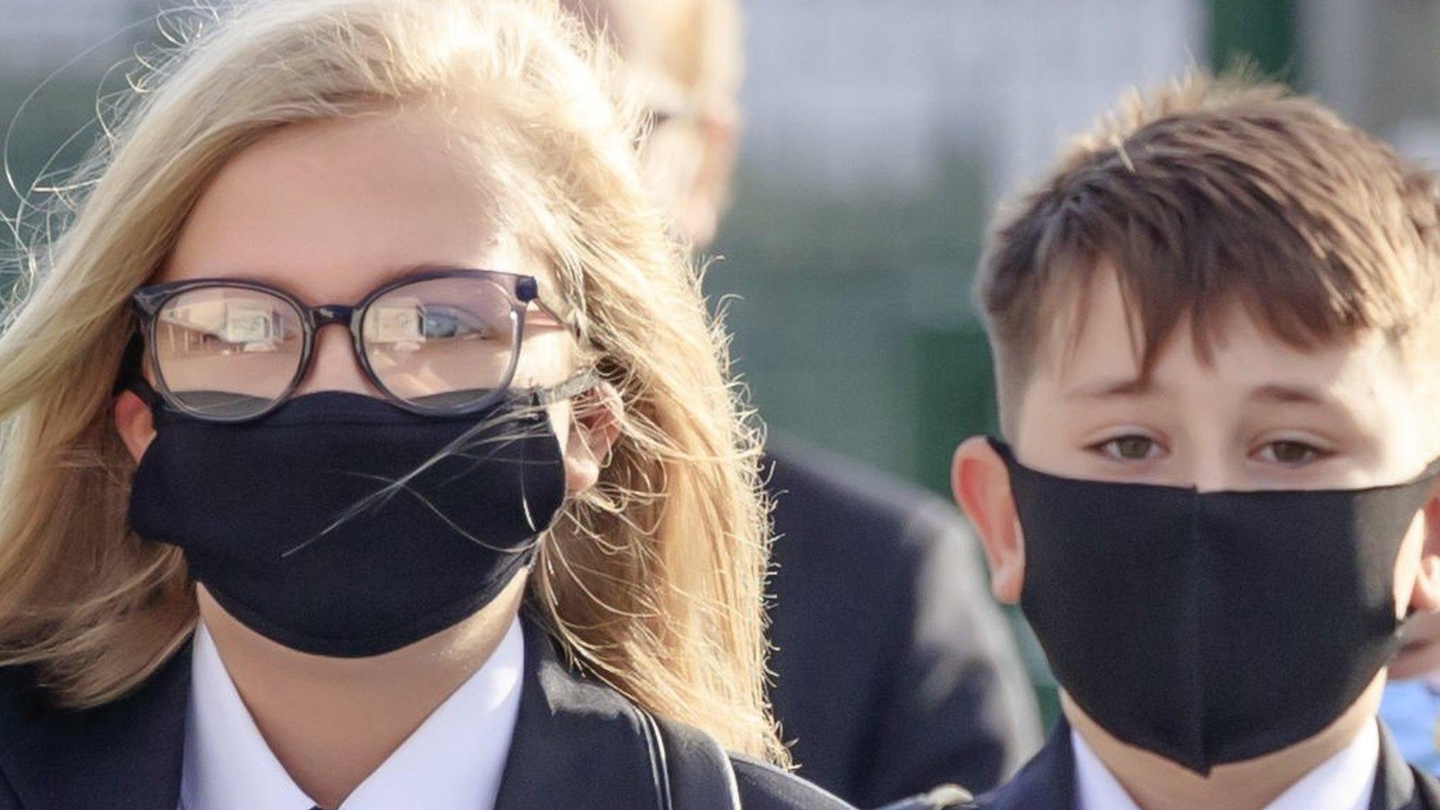 Schoolchildren wearing masks