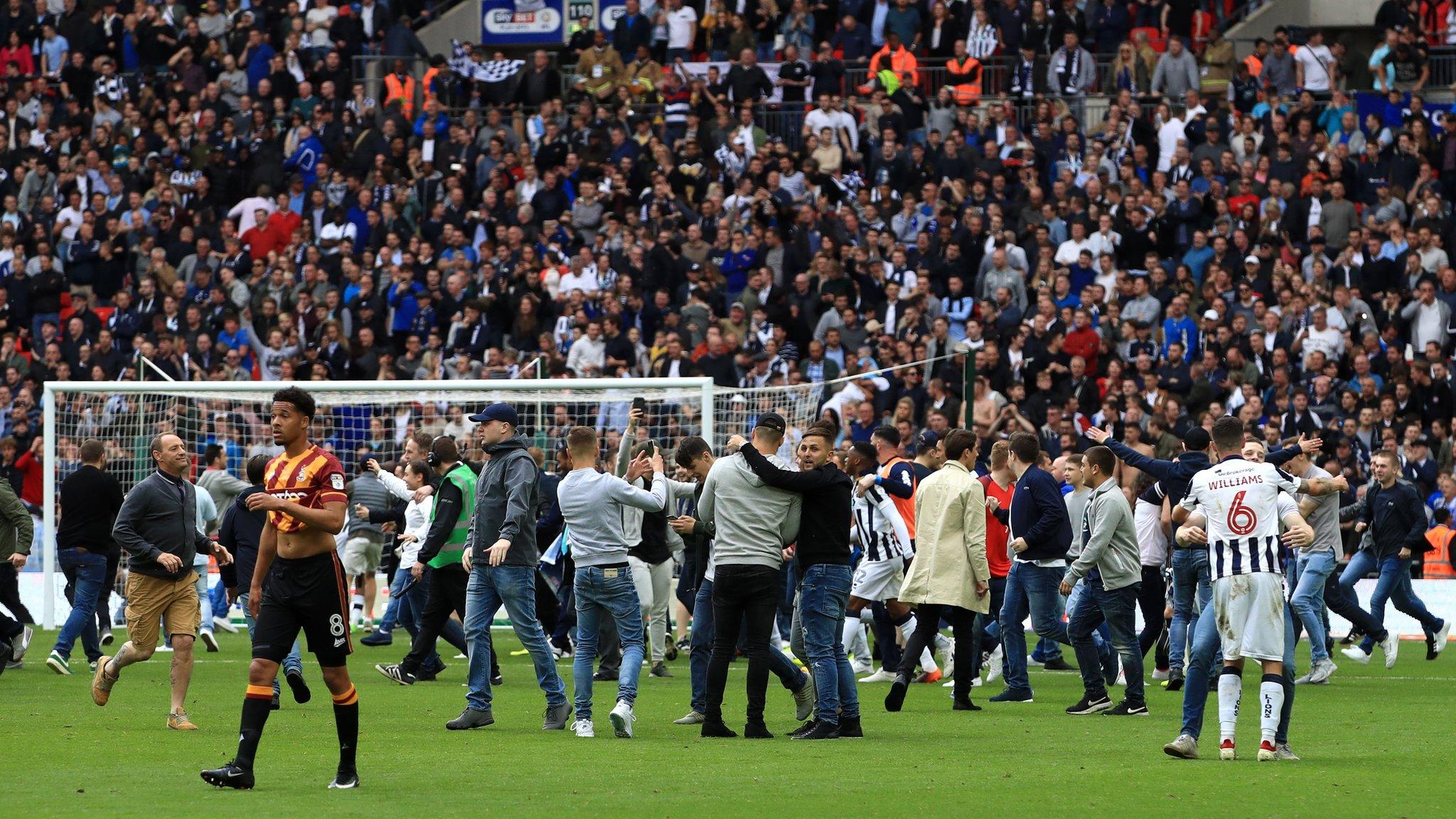 Millwall fans on the pitch at Wembley