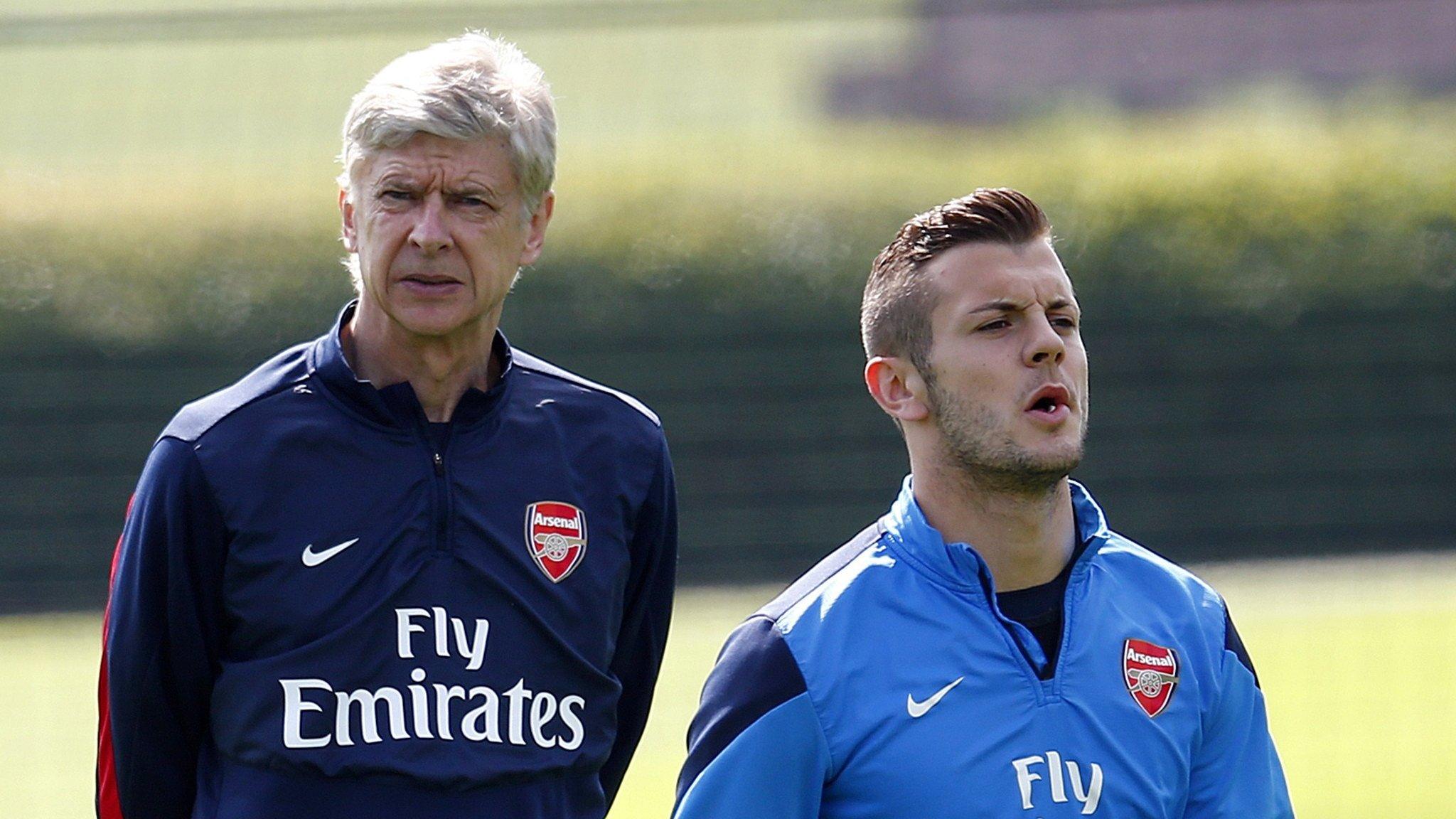 Arsenal manager Arsene Wenger (left) and Jack Wilshere