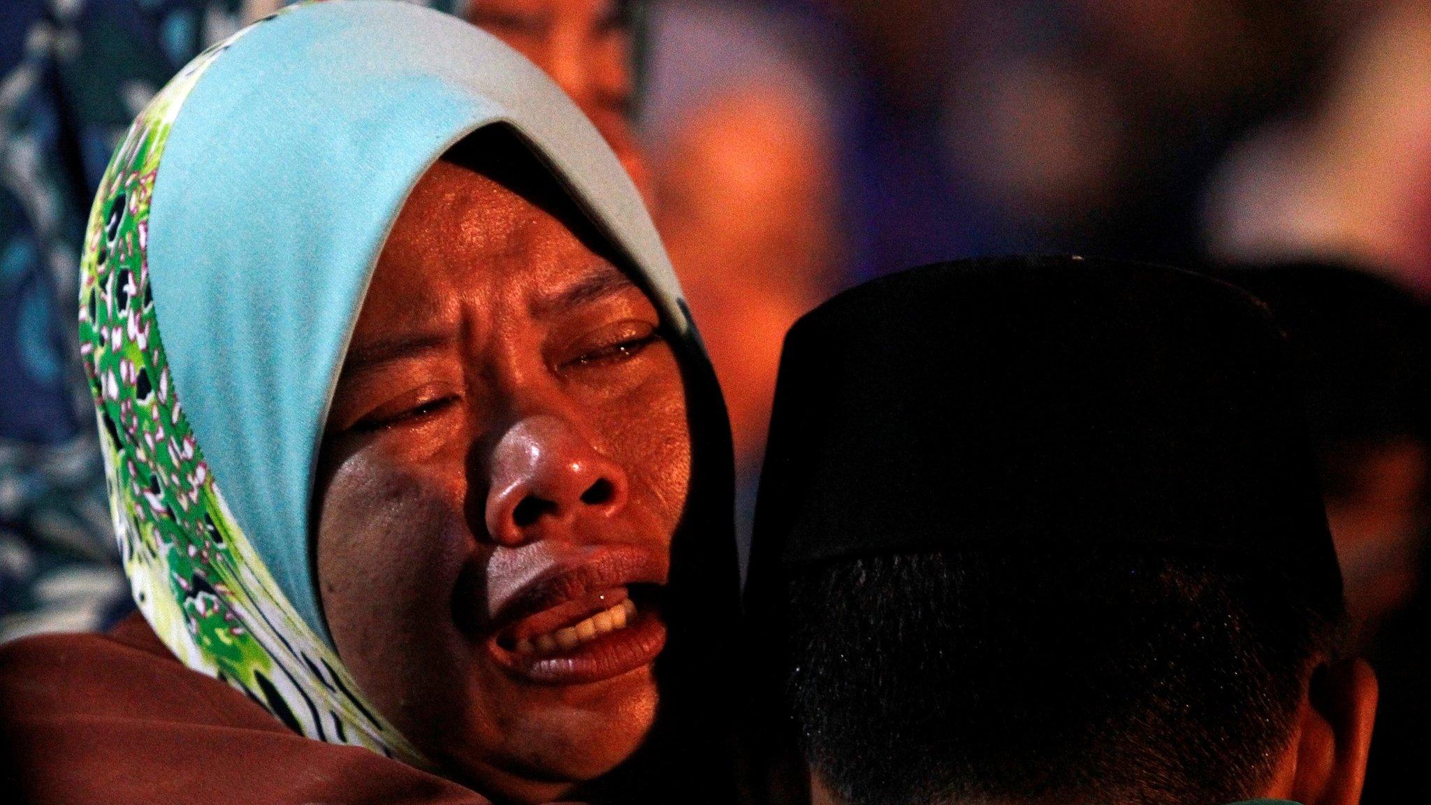 A family member of a victim of the Darul Quran Ittifaqiyah religious school fire cries during a burial in Kuala Lumpur, Malaysia September 15, 2017.