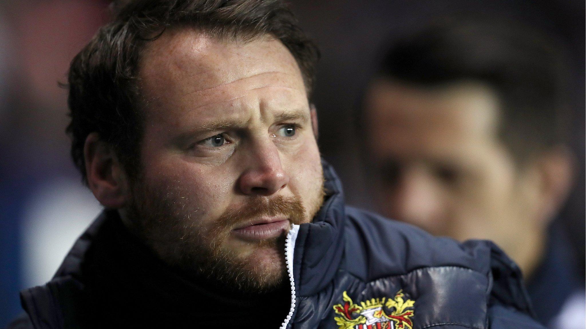 Darren Sarll watches on during his time as Stevenage boss