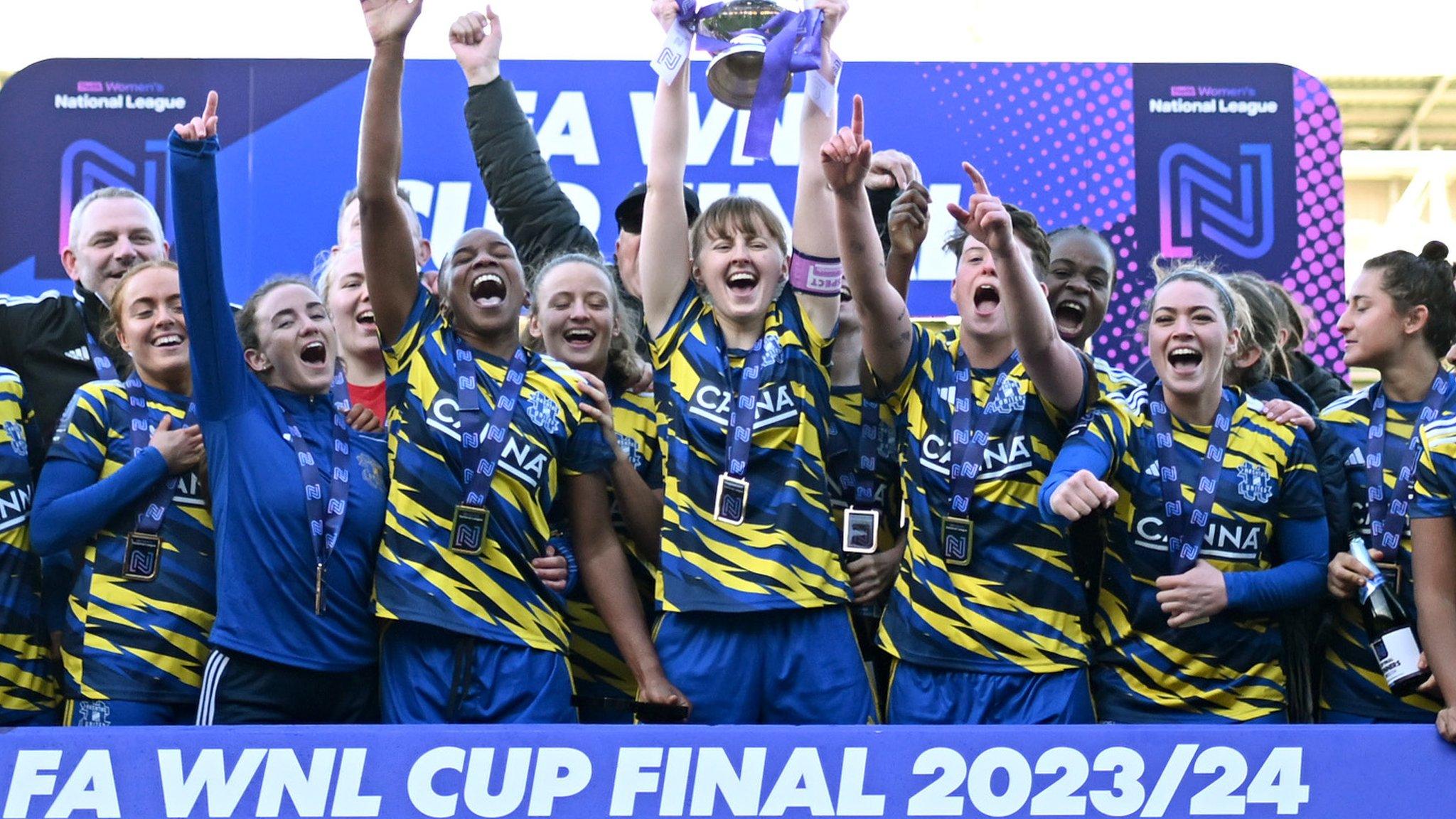 Hashtag skipper Grace Gillard lifts the trophy at Kenilworth Road