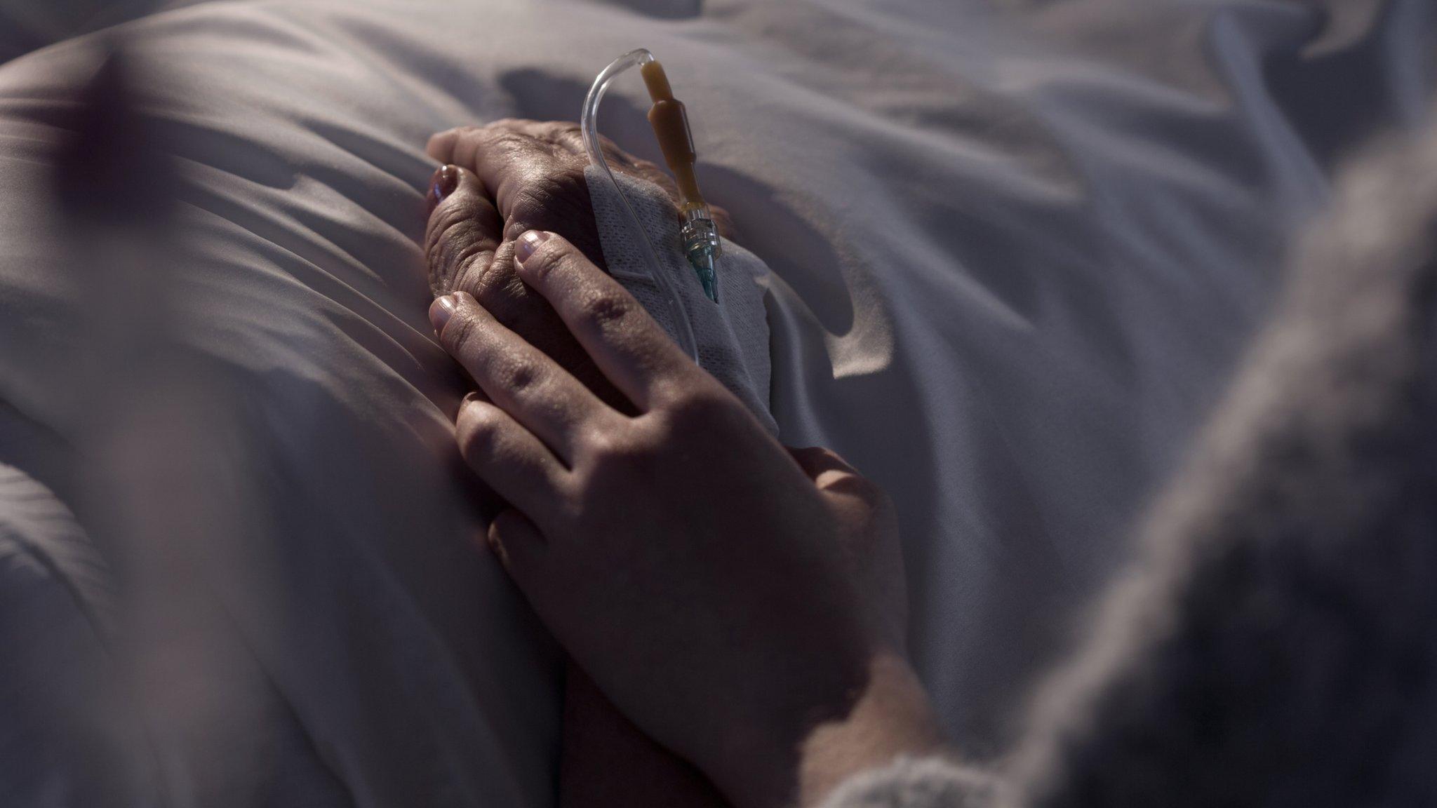 Woman comforting patient