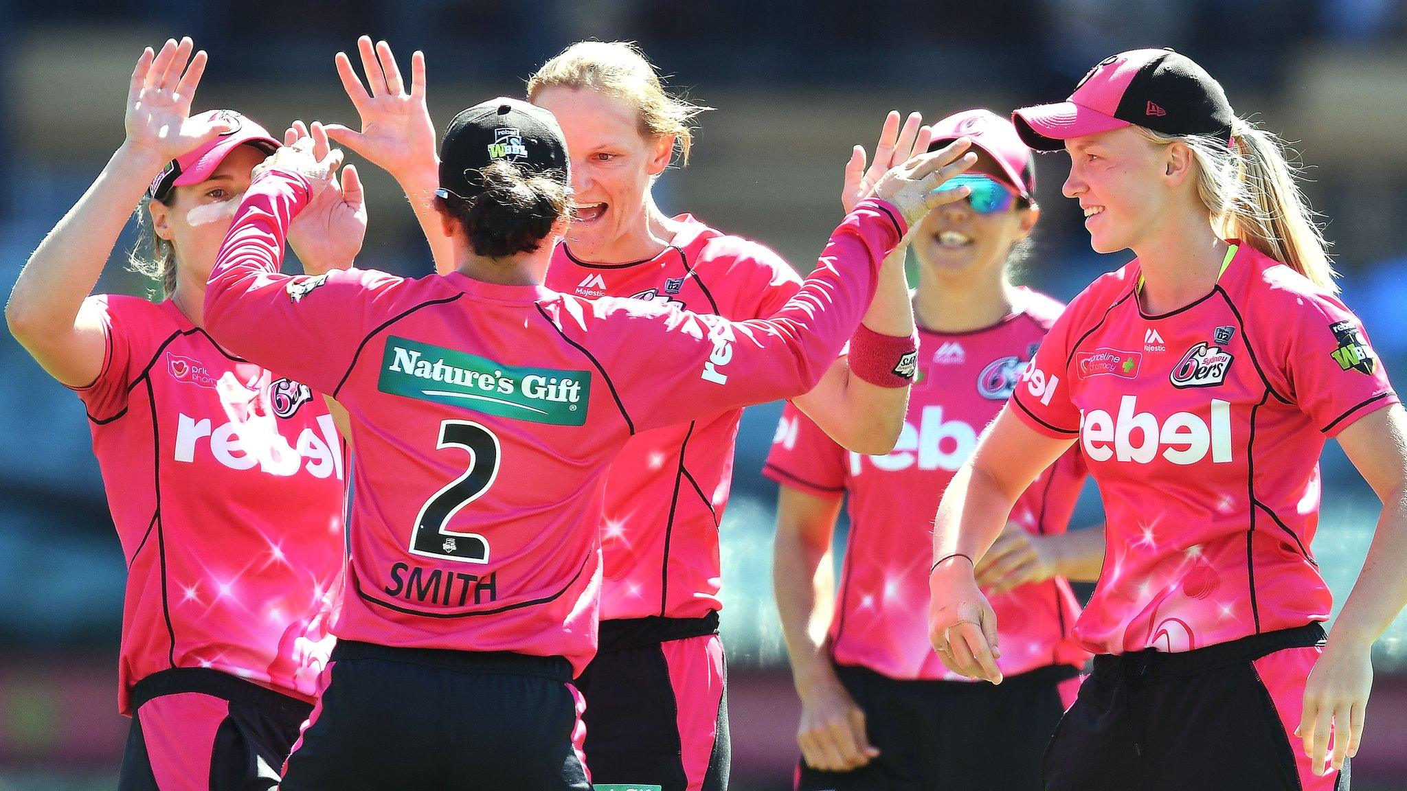 Sydney Sixers celebrate a wicket