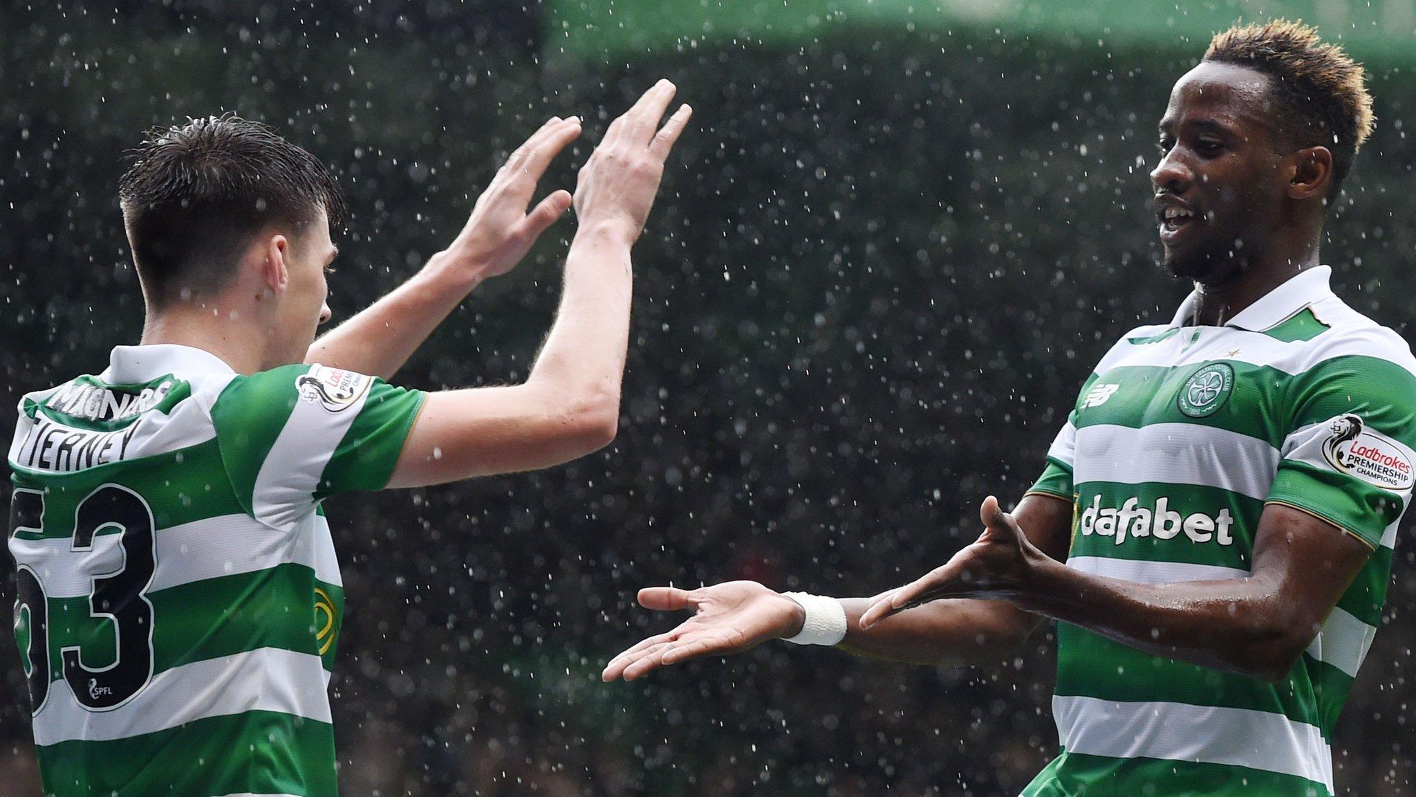 Moussa Dembele celebrates a goal with Celtic team-mate Kieran Tierney