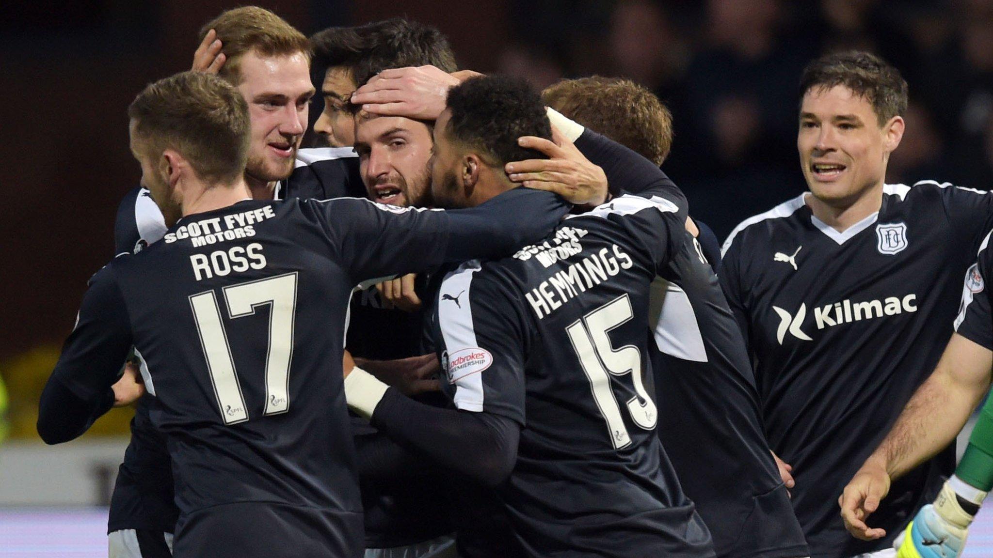 Dundee players celebrate Craig Wighton's late goal