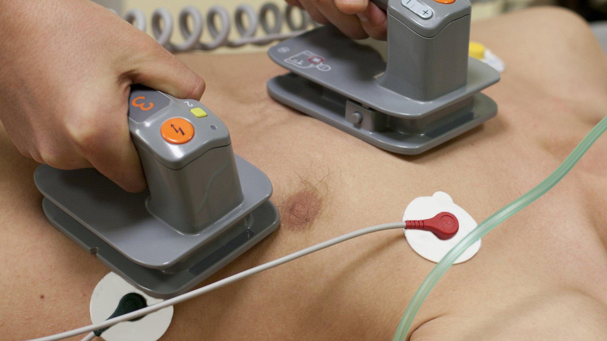 Stock image of a defibrillator being used