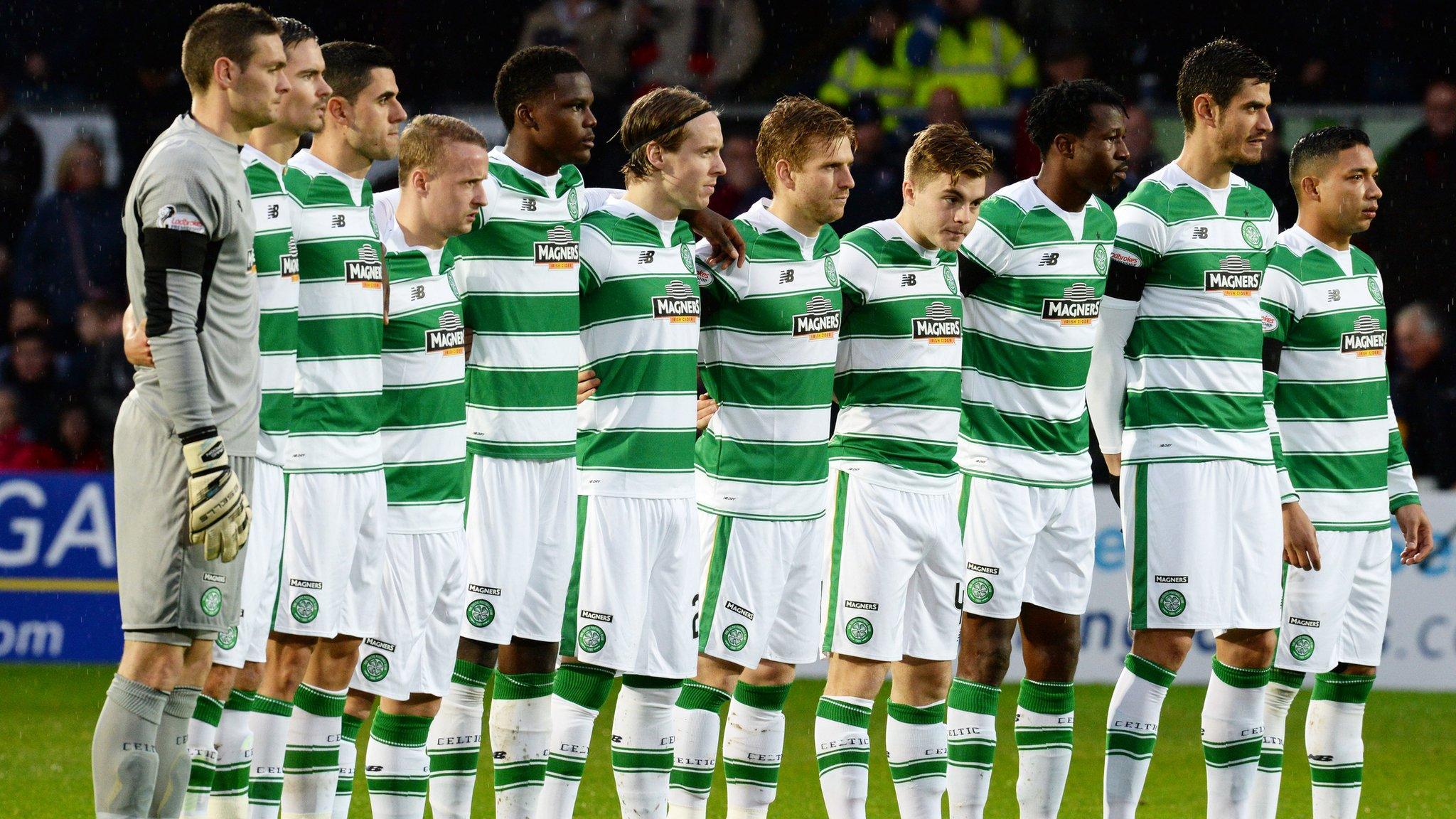 Celtic players observe a minute's silence before Sunday's match against Ross County