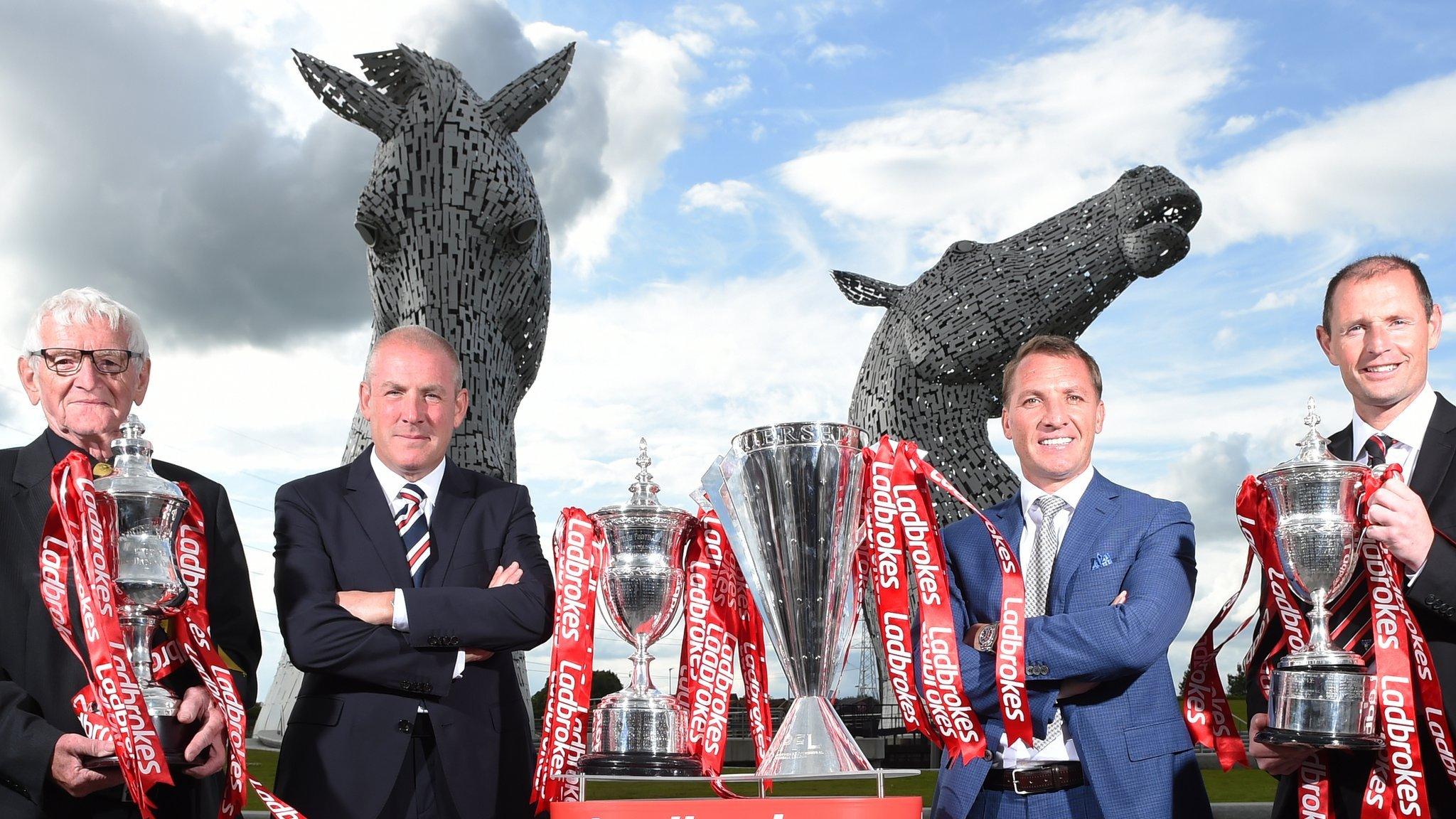 East Fife vice chairman Dave Marshall, Rangers manager Mark Warburton, Celtic boss Brendan Rodgers and Dunfermline manager Allan Johnston pose with the league trophies won by their clubs last season